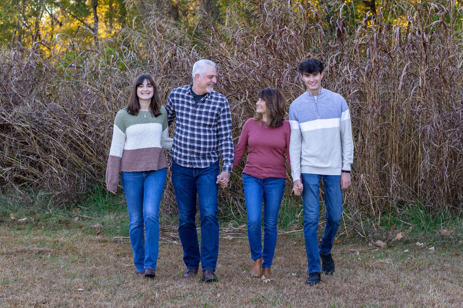 Family portrait walking and holding hands at Line Creek Trail Kansas City | Kansas City Northland Portrait Photographer