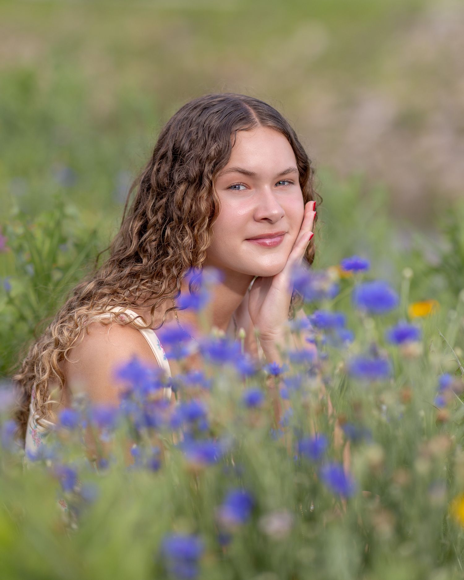Senior portrait photo of a young lady among the flowers at English Landing Park in Parkville | Kansas City Northland Portrait Photographer