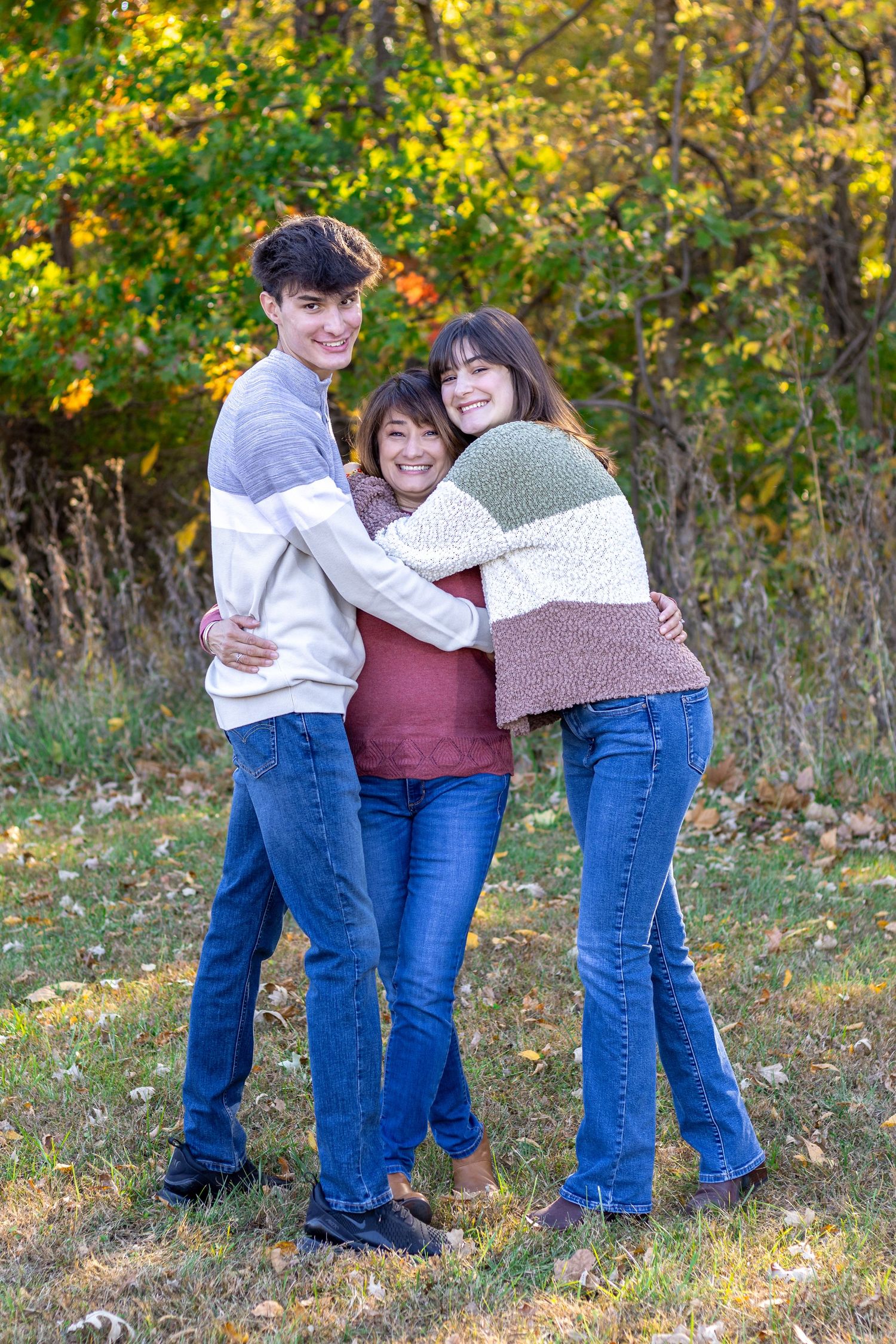 Photo of mother and two teens hugging during family portrait session at Line Creek Trail | Kansas City Northland Portrait Photographer