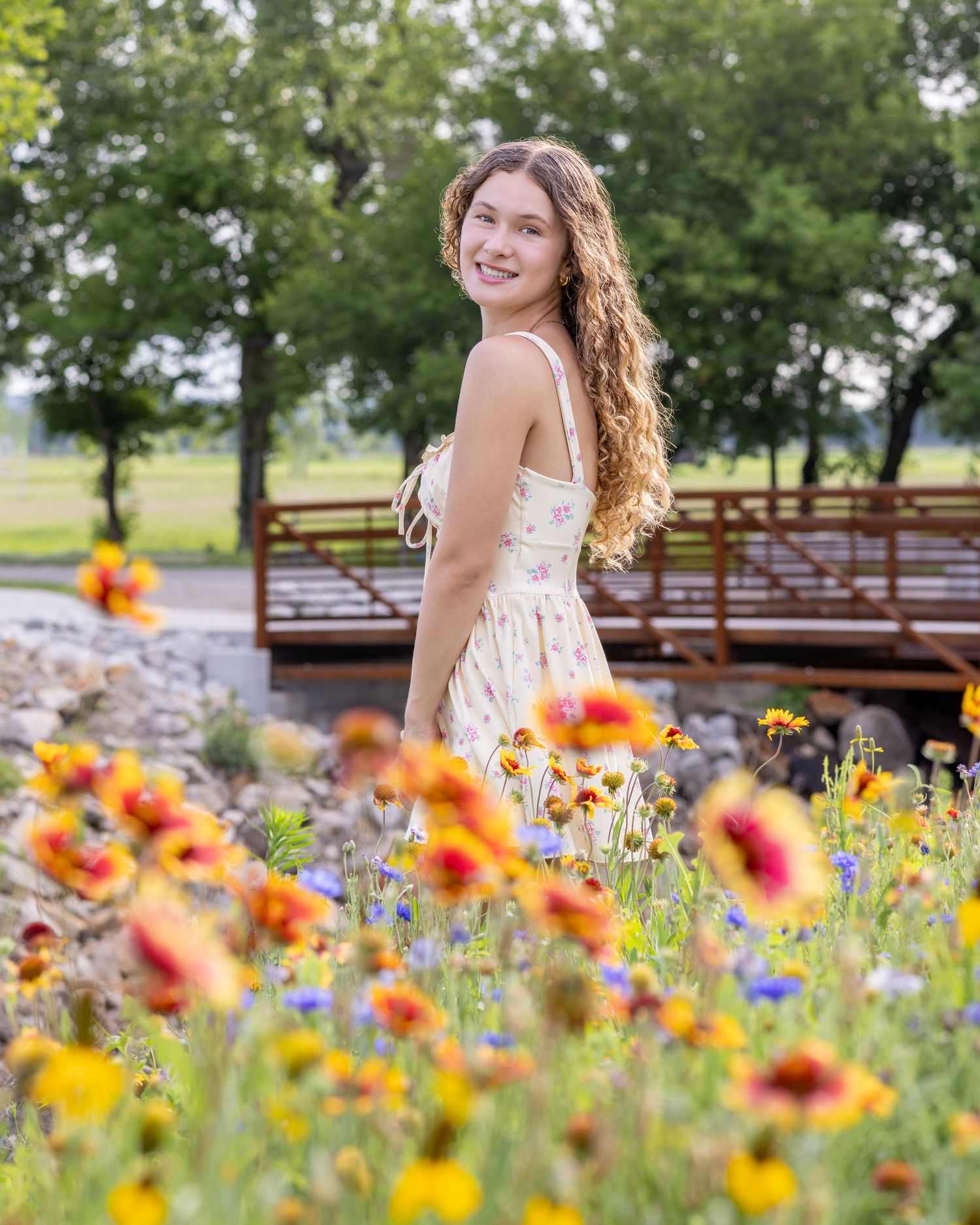 Senior portrait photo of a young lady among the flowers at English Landing Park in Parkville | Kansas City Northland Portrait Photographer