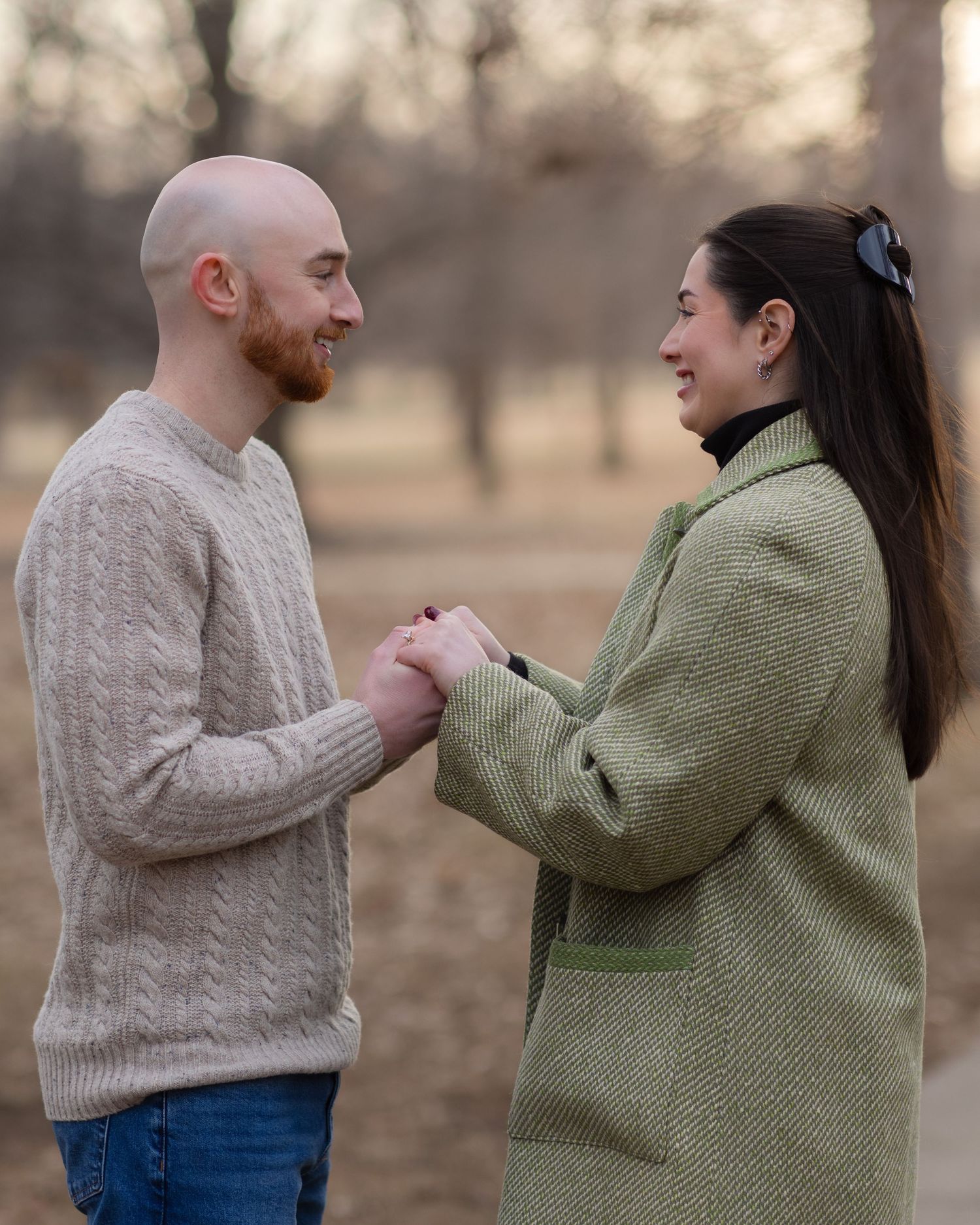 Portrait of a young couple holding hands and looking at each other at Loose Park Kansas City | Kansas City Northland Portrait Photographer