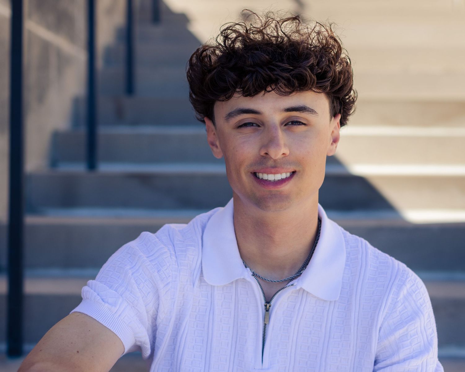Senior portrait photo of a young man on steps of Nelson-Atkins Museum in Kansas City | Kansas City Northland Portrait Photographer