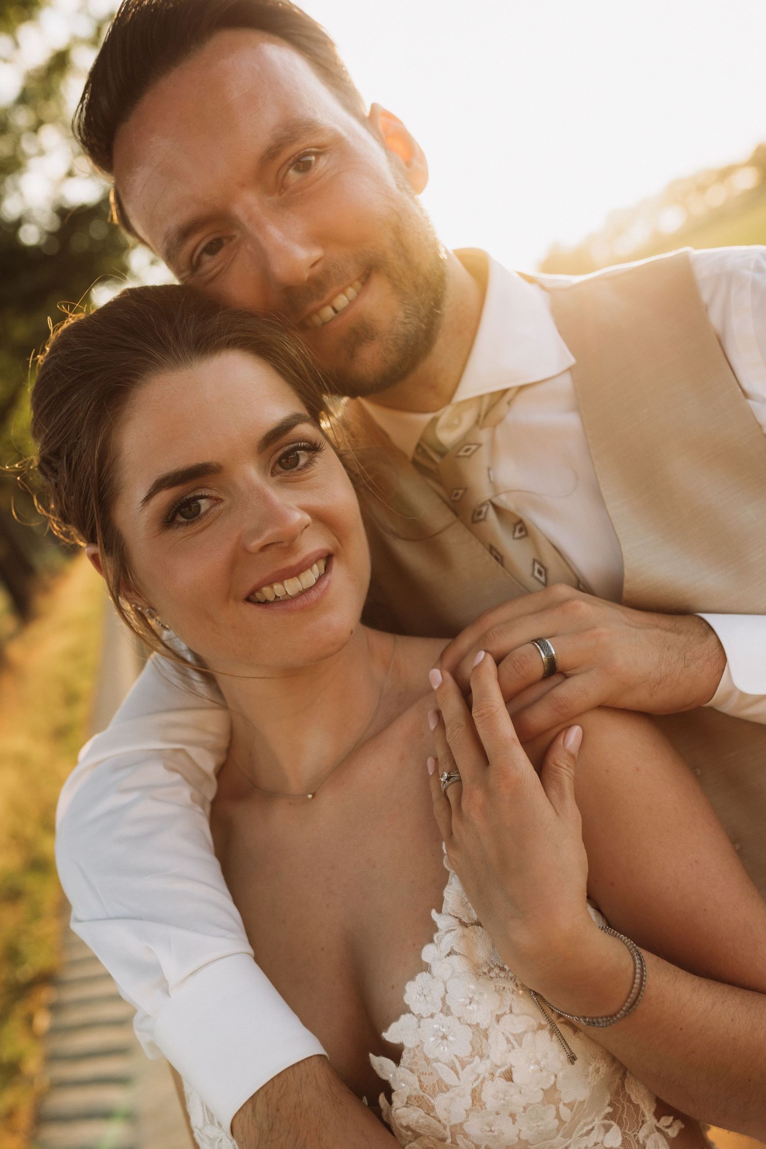 Close-up of a tender wedding moment captured in warm evening light.