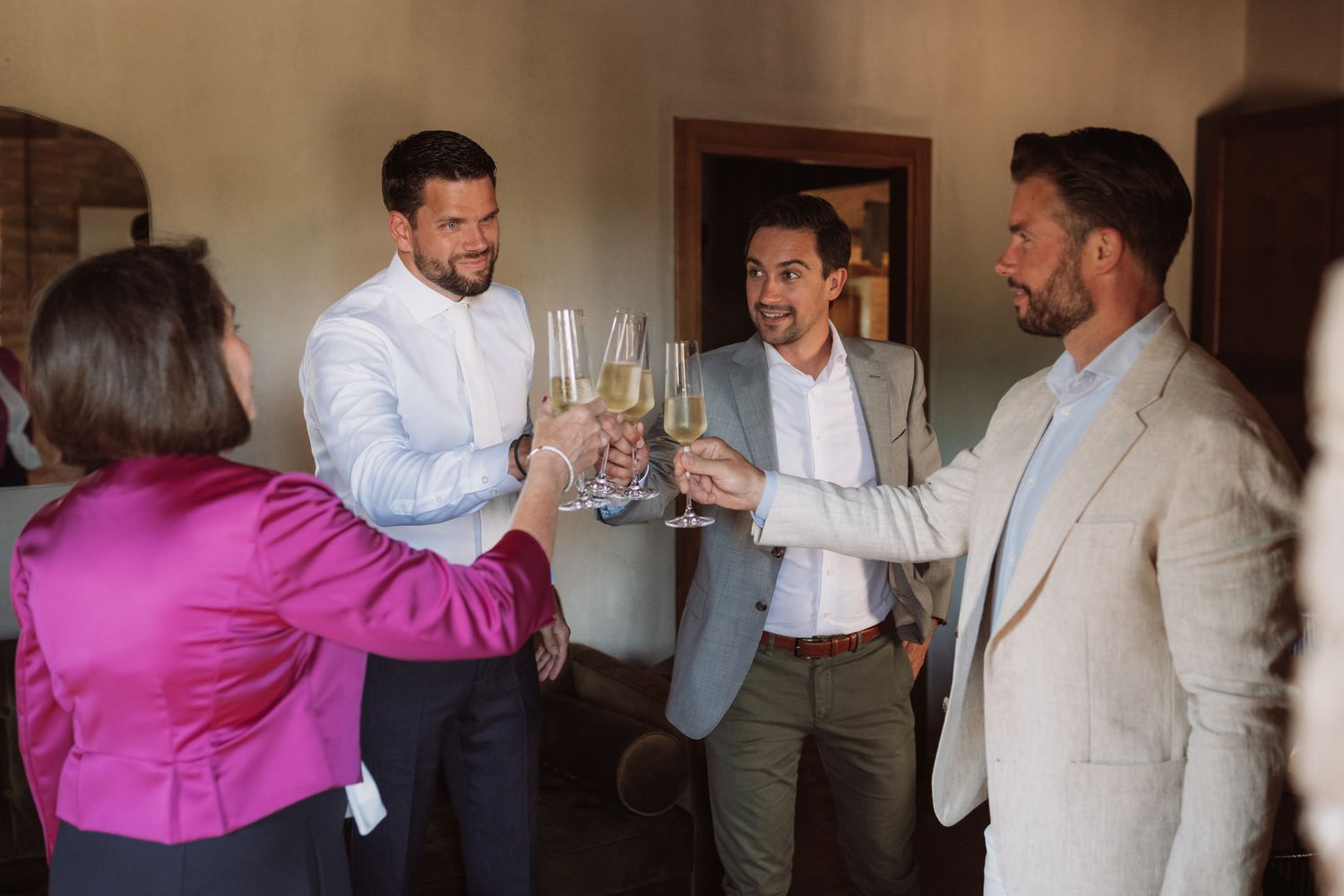 A series of candid moments showing people toasting and celebrating at an indoor gathering.