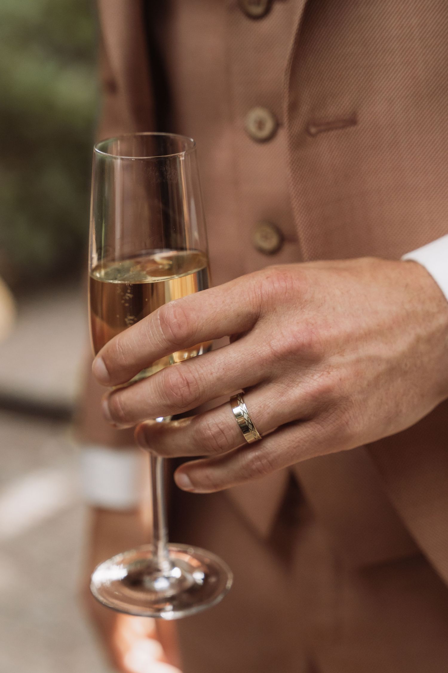 Close-up shot of hands holding wine glasses in a sequence showing different angles and positions.