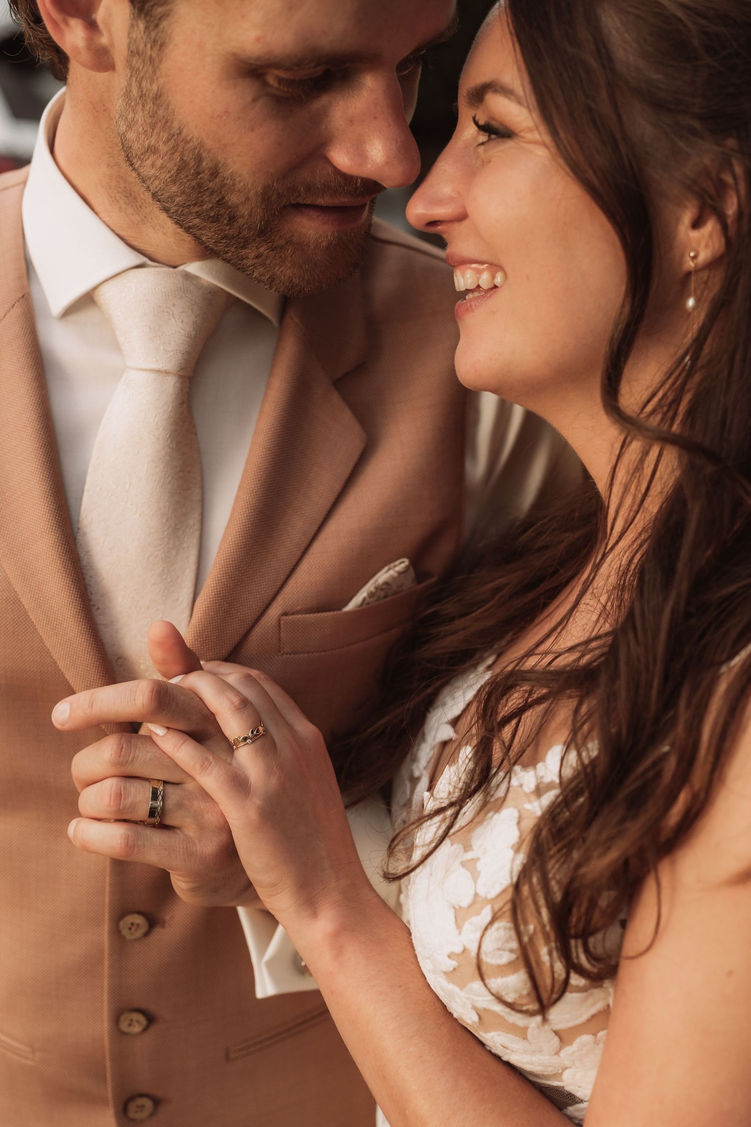Romantic close-up shots of couple embracing and sharing intimate moments in warm lighting.