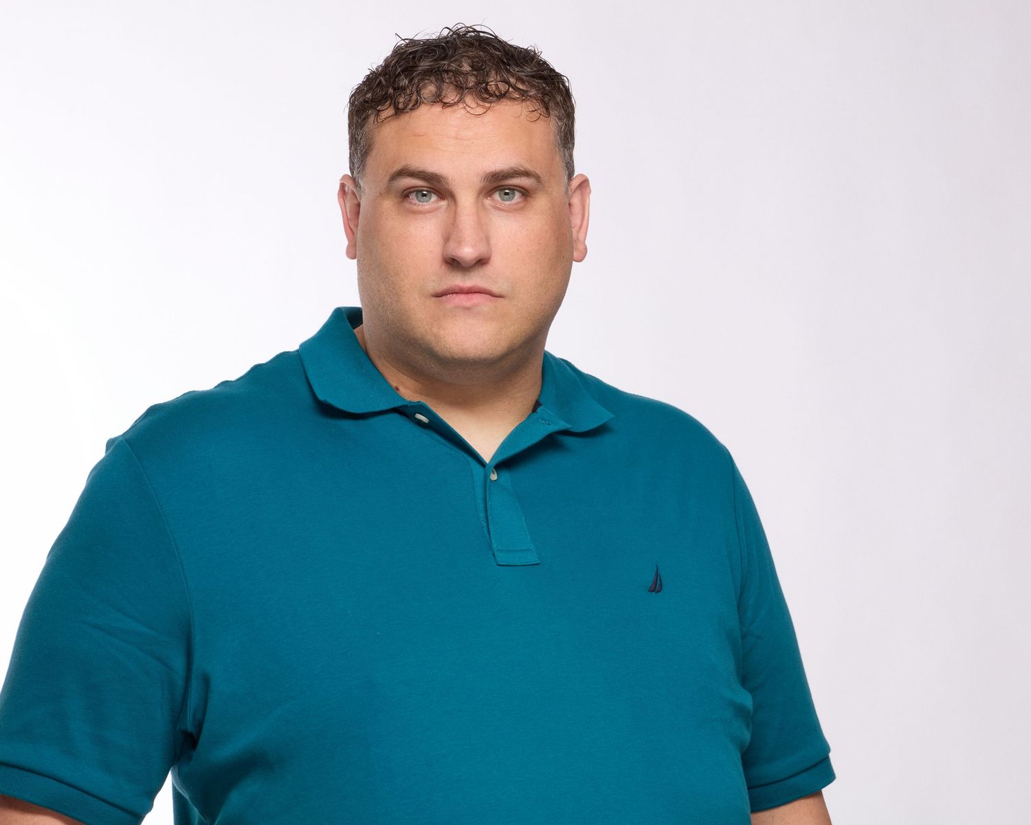 Professional branding linkedin headshot of an entrepreneur in a blue polo, Eugene Oregon photographer