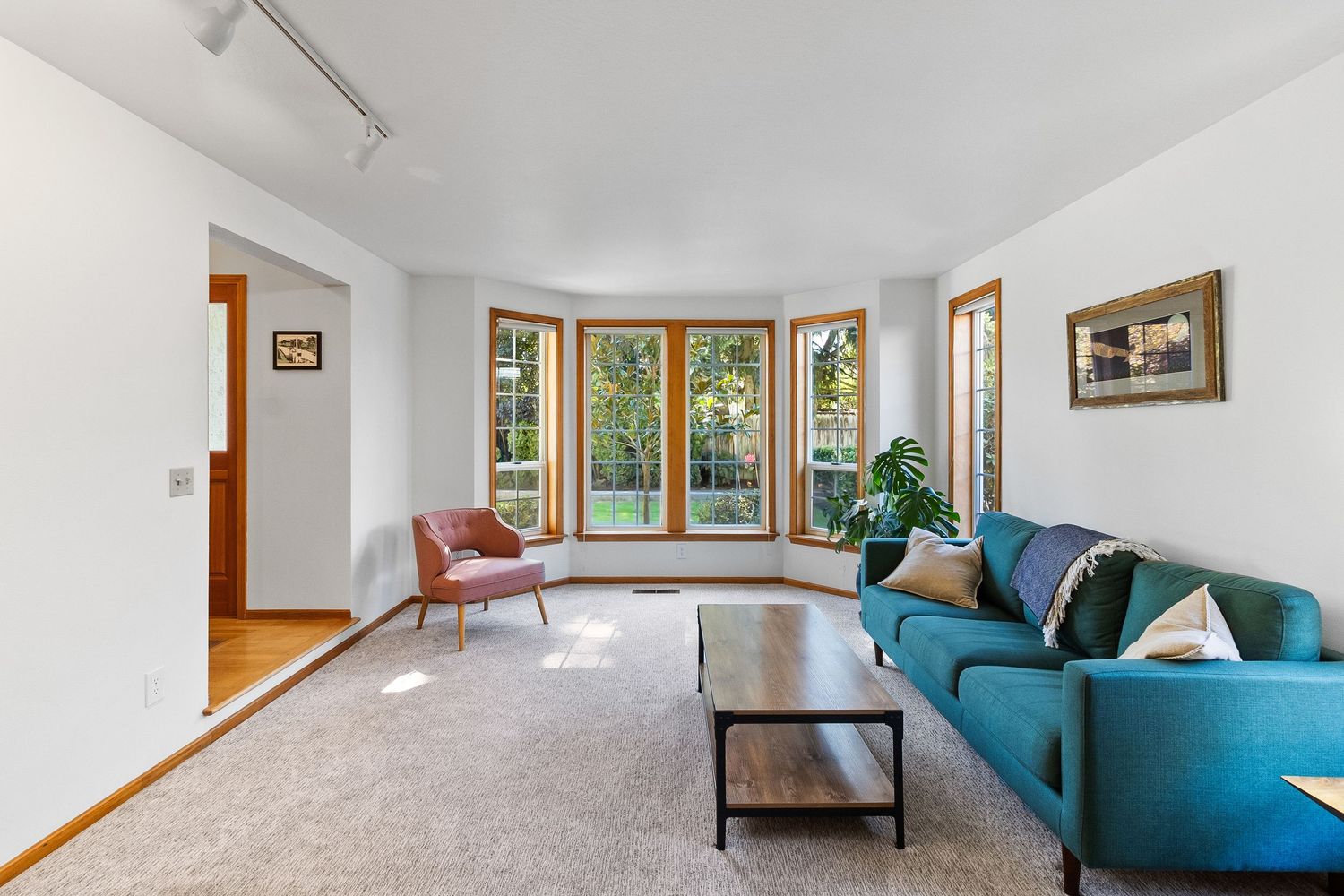 Commercial interior photography for hospitality and real estate spaces featuring clean, modern living area with natural light