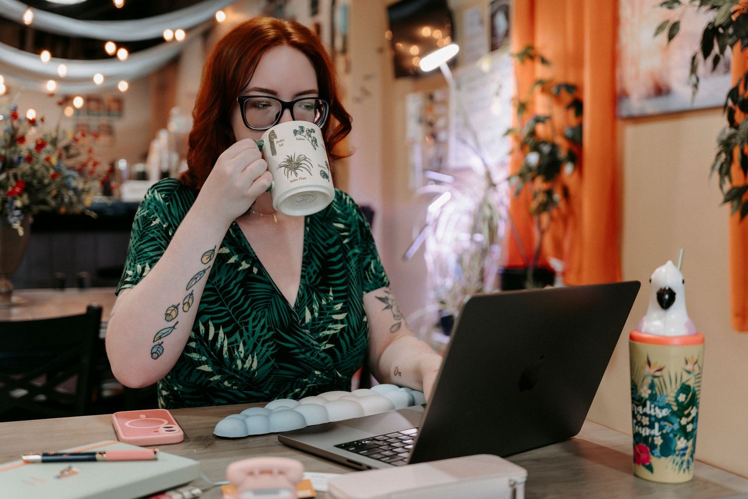 Katie of WebDesignToo drinking a cup of coffee at UniTea kava lounge in Dunedin, Florida.