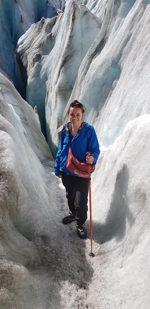 The photographer hiking in an ice glacier in NZ. Displaying her love for the outdoors, travel & adventure
