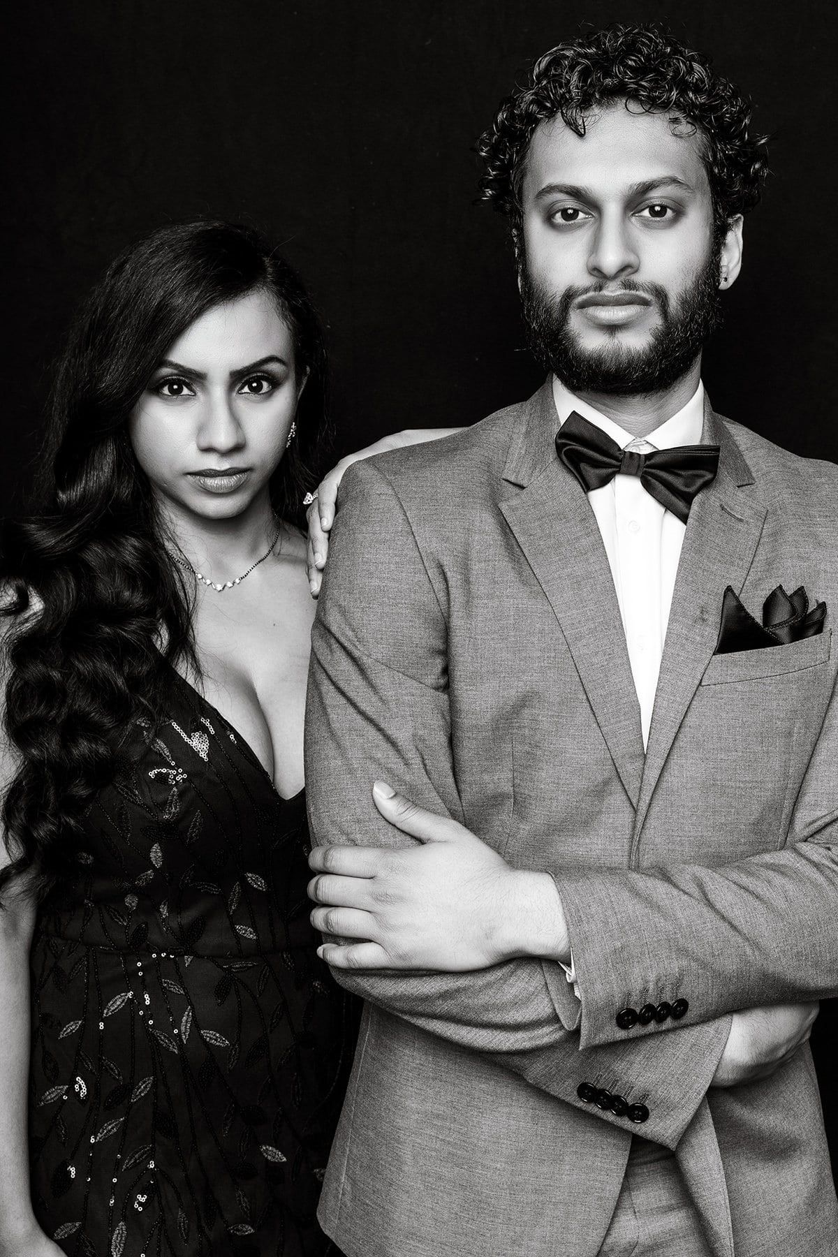 Black and white portrait sequence of couple in formal attire showing playful expressions.