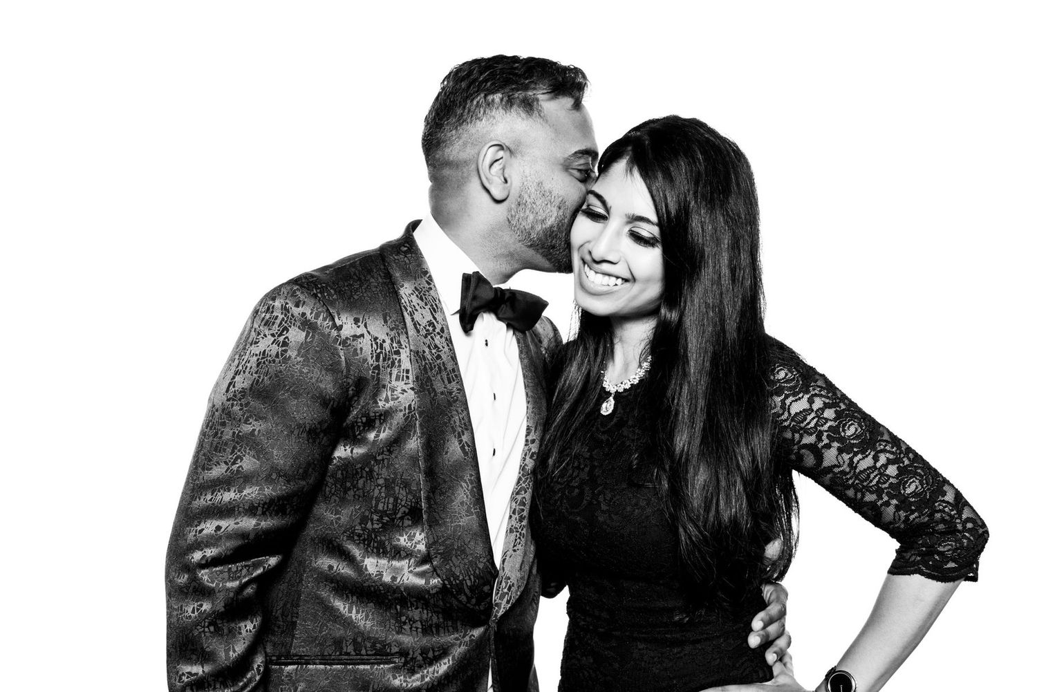 Romantic black and white photo series of couple embracing in formal evening wear.