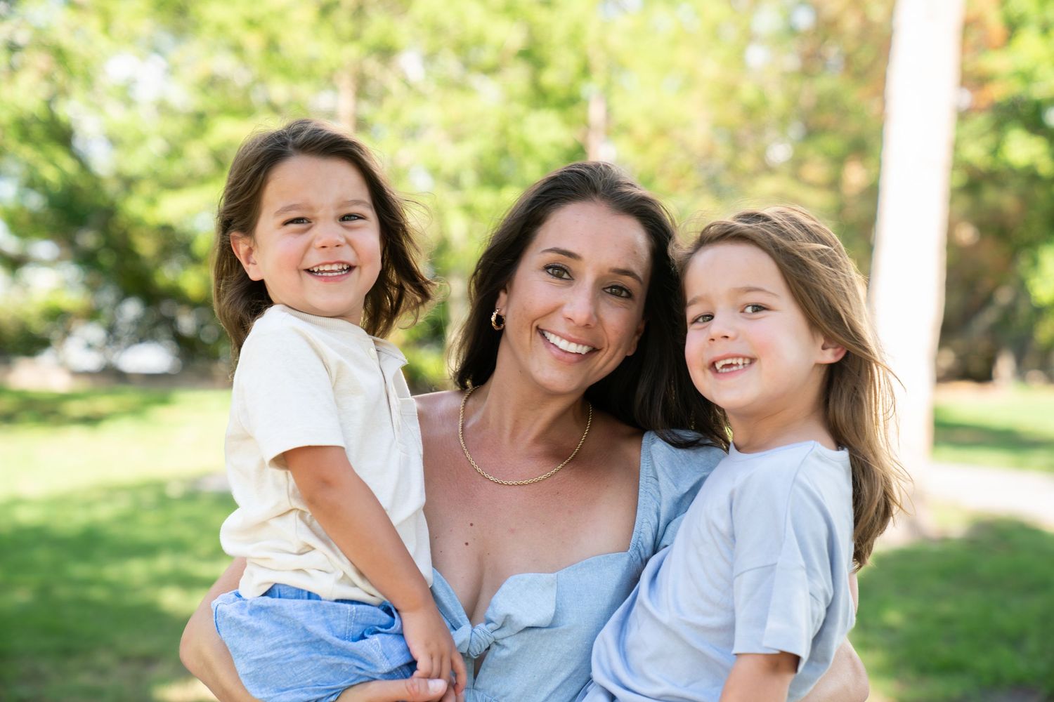 A collection of candid outdoor family portraits showing joyful moments and natural interactions in a park setting.