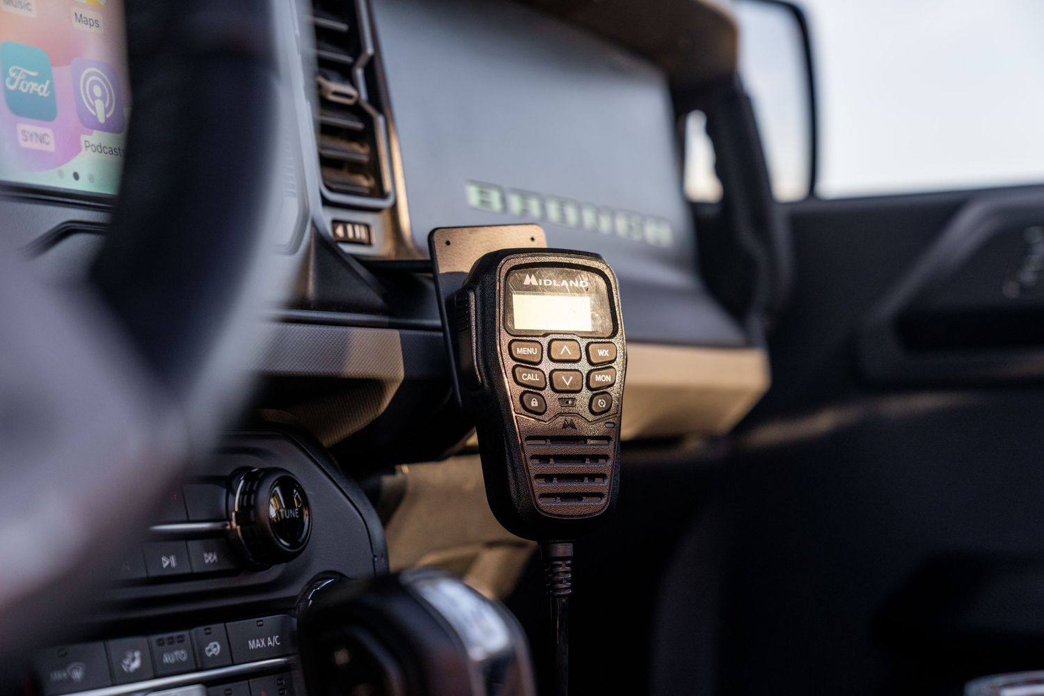 Close-up of modern vehicle dashboard display showing navigation interface.