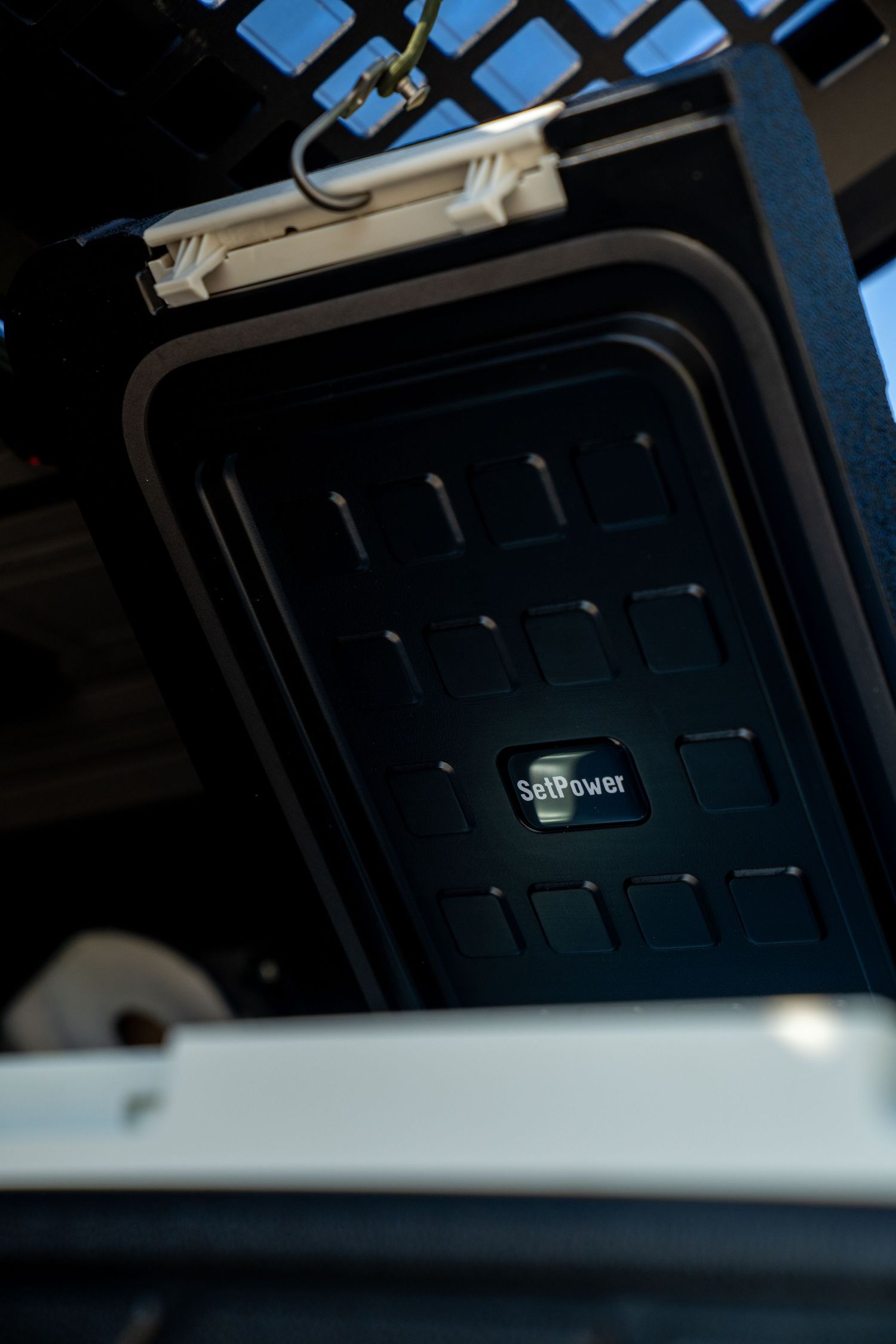 Dark interior shot of a vehicle's sunroof installation.