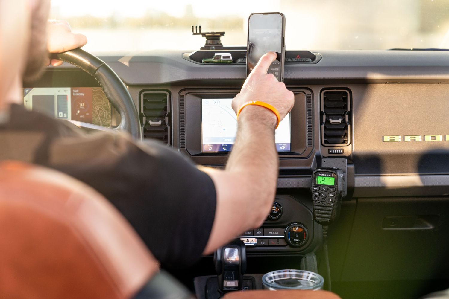 Interior view of vehicle dashboard showing digital display interface.
