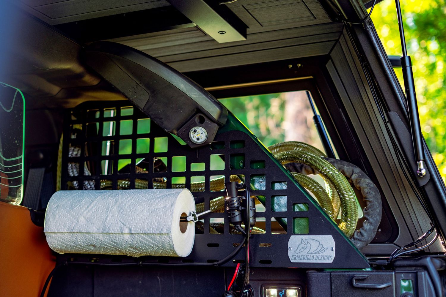 Interior view of a vehicle's roof-mounted storage and organization system.
