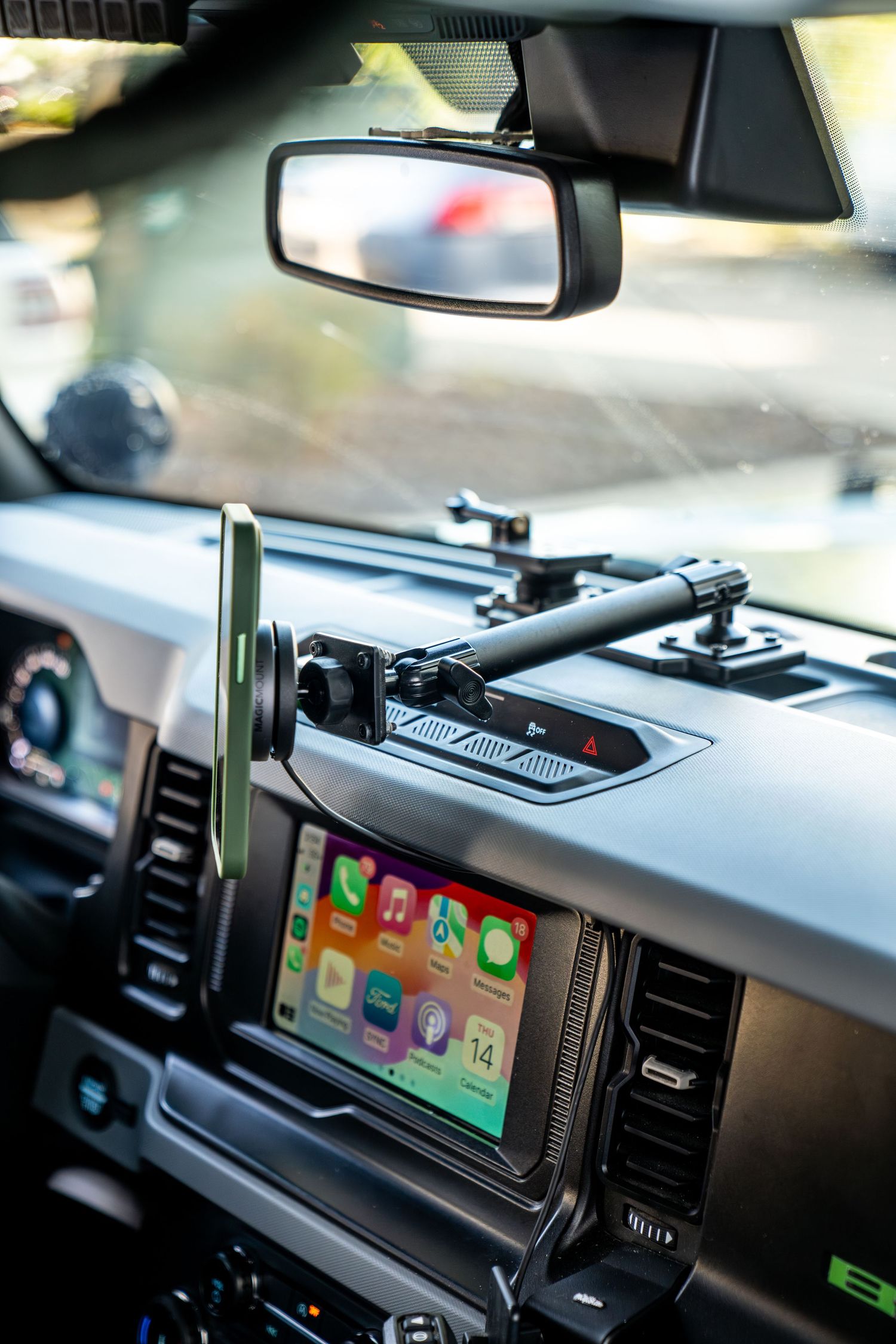 Modern vehicle dashboard with mounted GPS navigation display and controls.