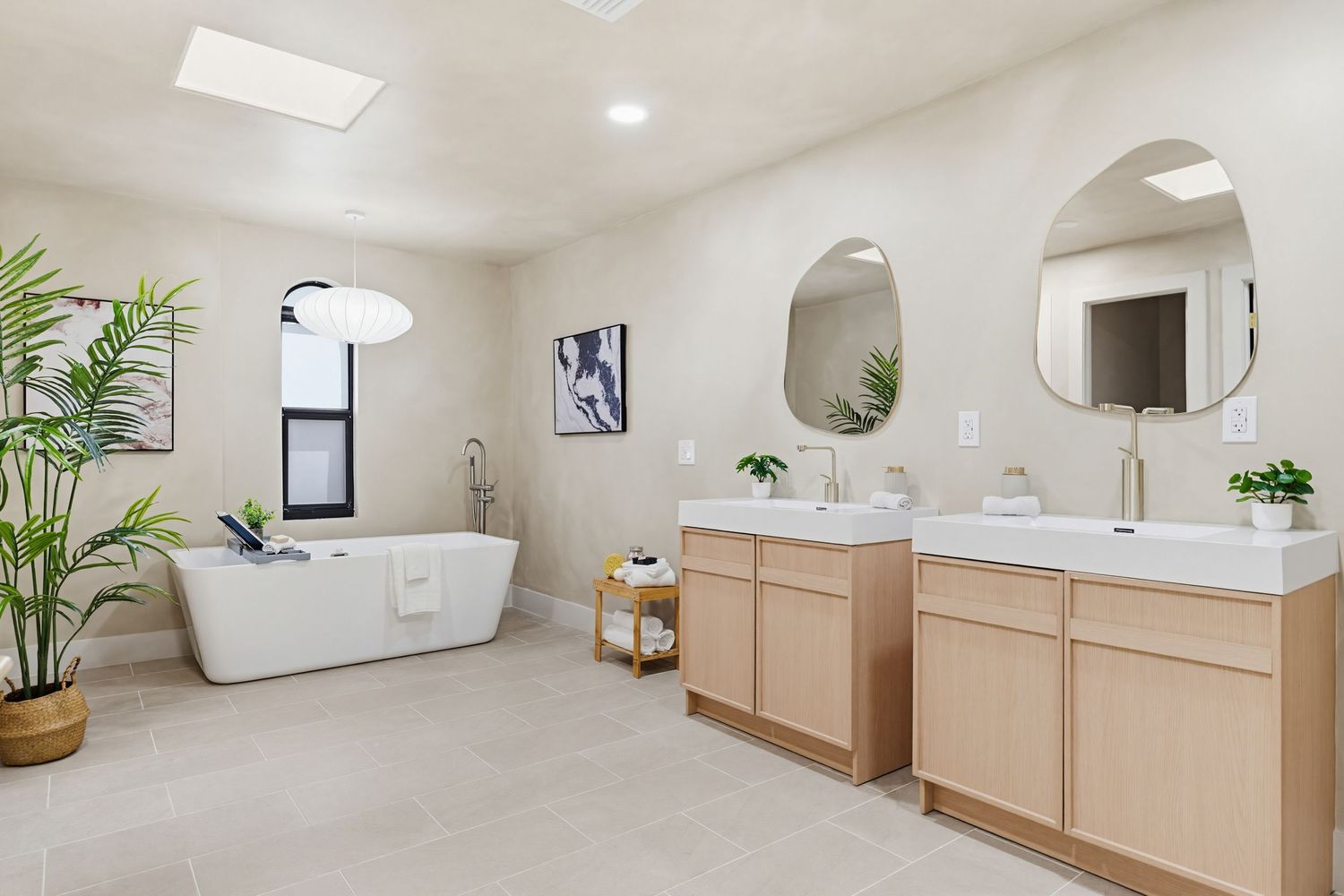 Modern minimalist spa interior with light wood accents, white walls, and potted plants creating a serene atmosphere.
