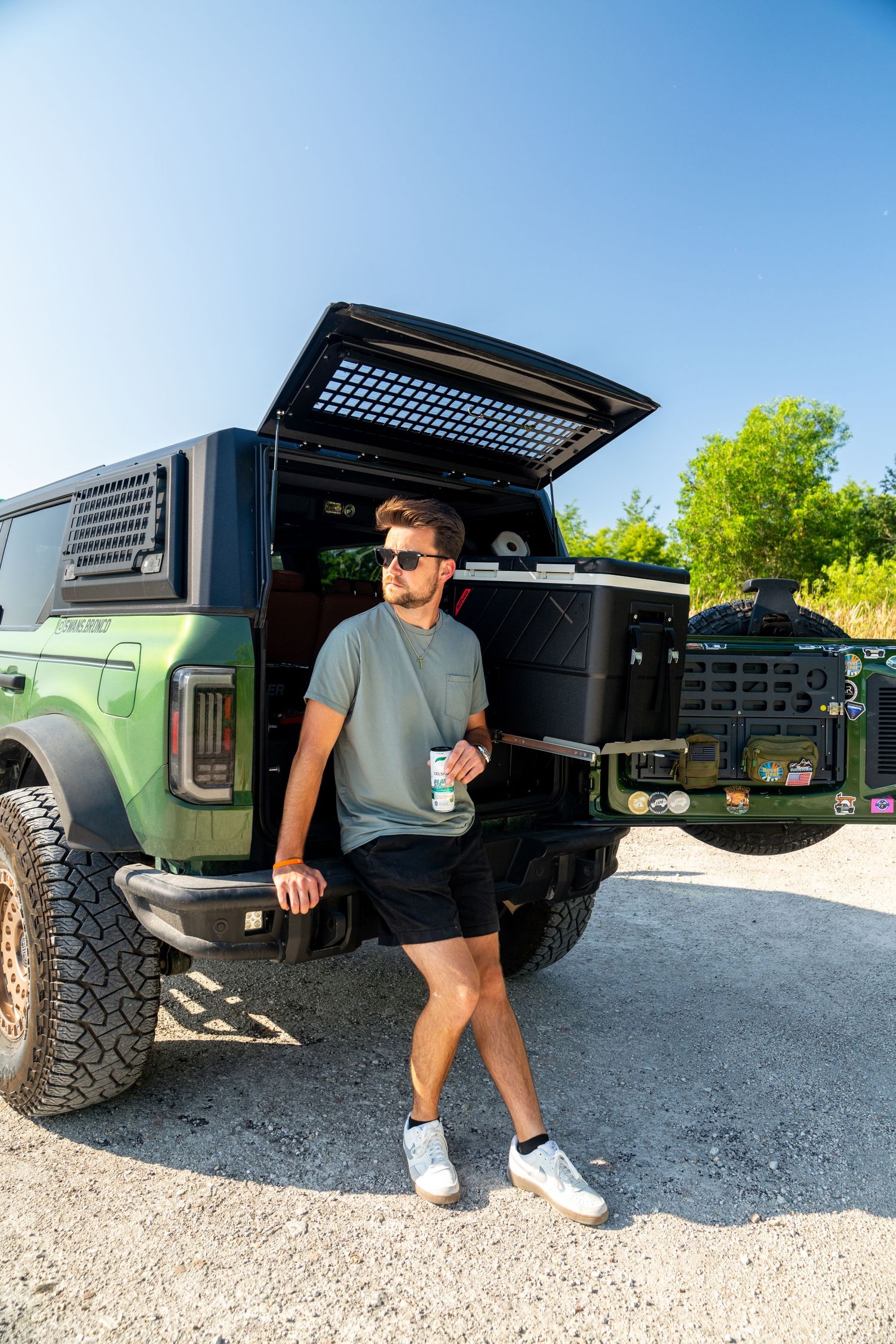 Low-angle view of a modified off-road vehicle with custom storage solutions.