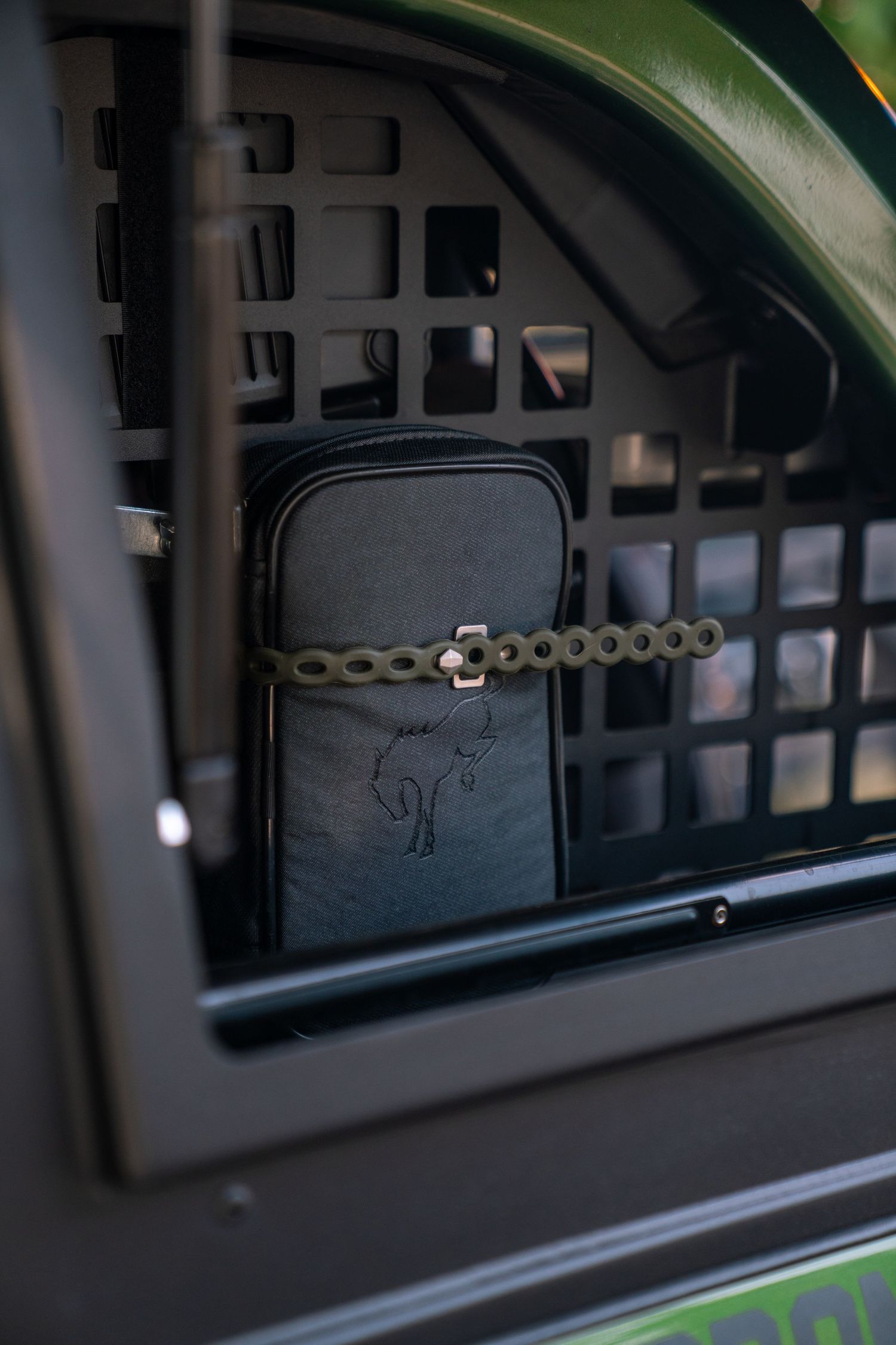 Interior view of a black vehicle roof rack system with mounting hardware visible.