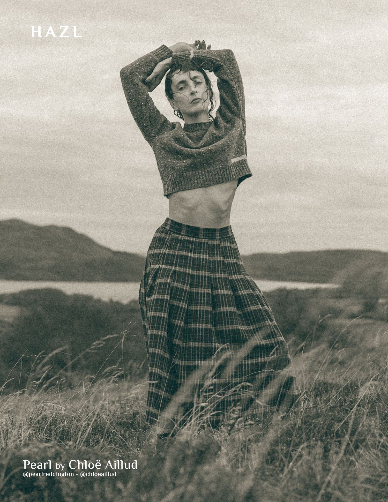 Artistic black and white fashion series in plaid skirt against rolling hills landscape.