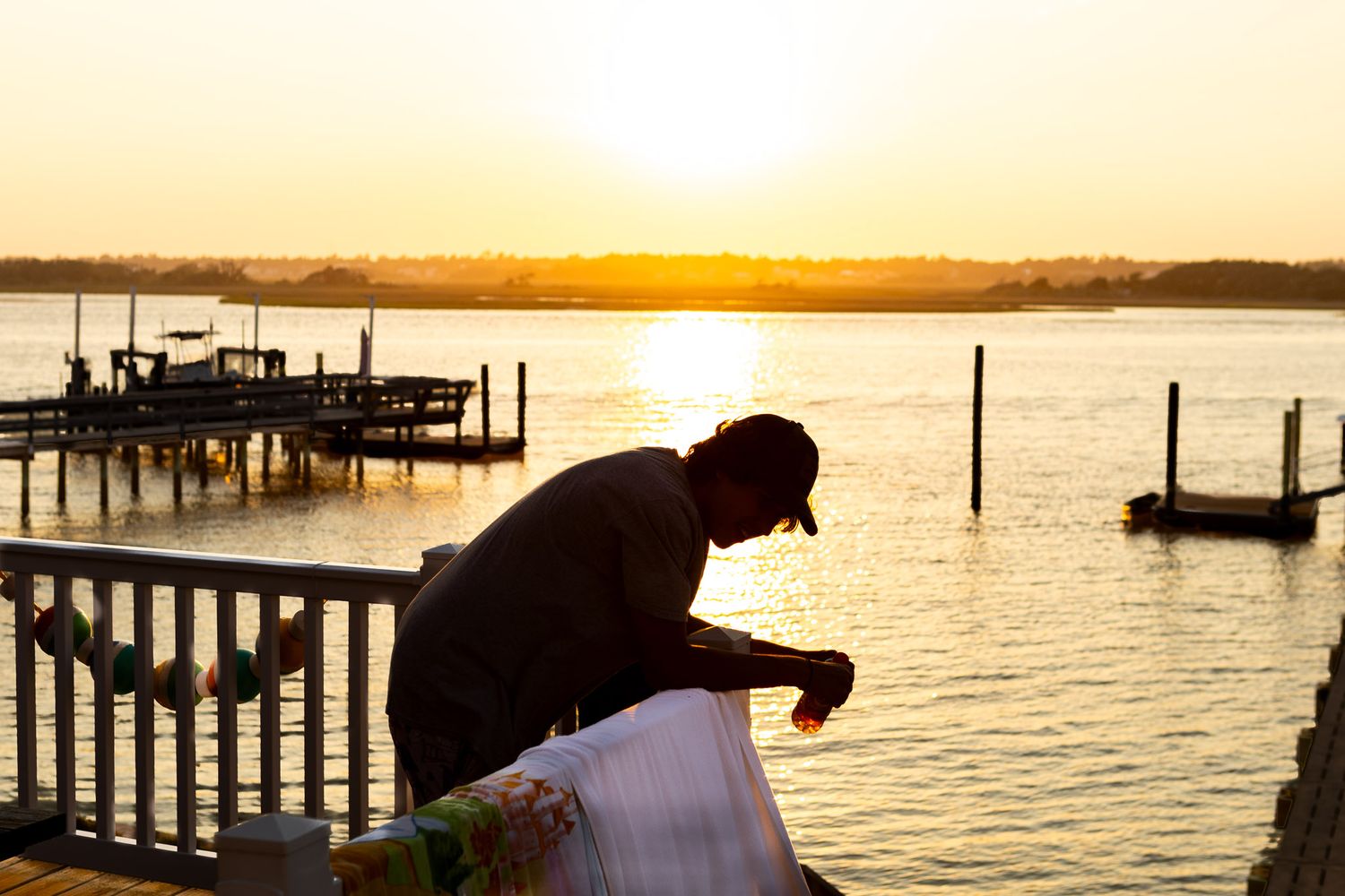 sunset at the dock with fisherman