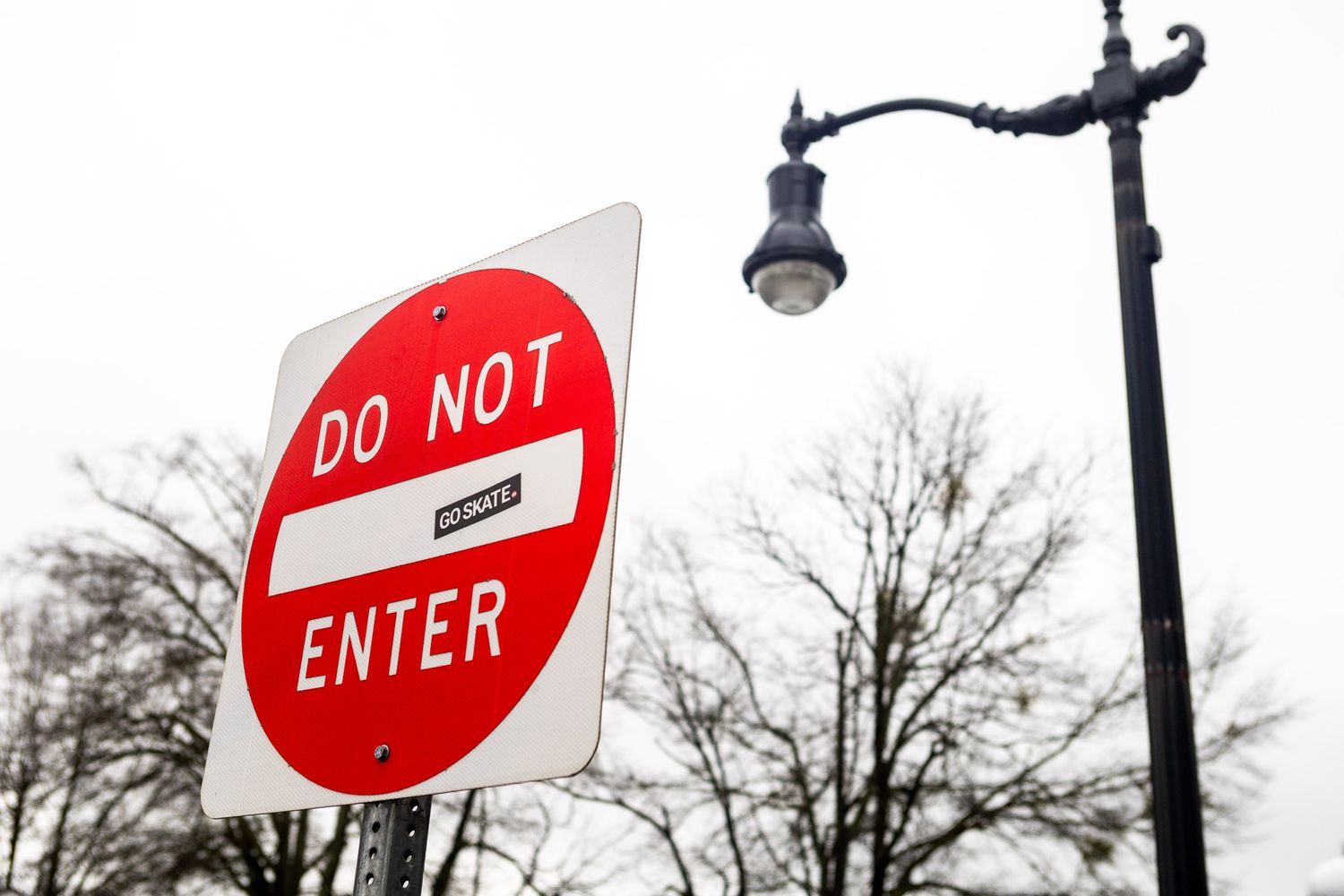 do not enter sign with a skate sticker
