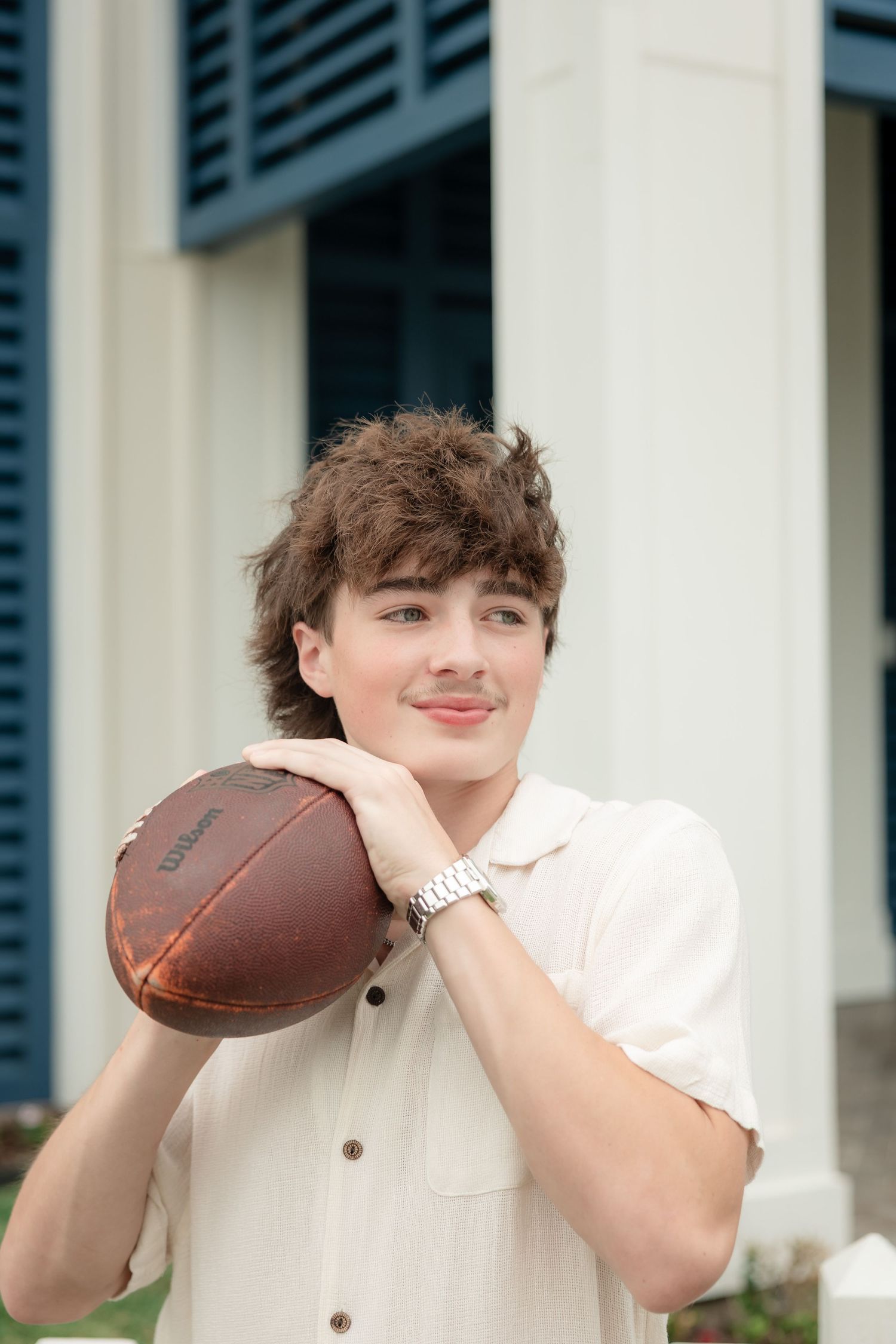 senior boy with football portrait galveston photo