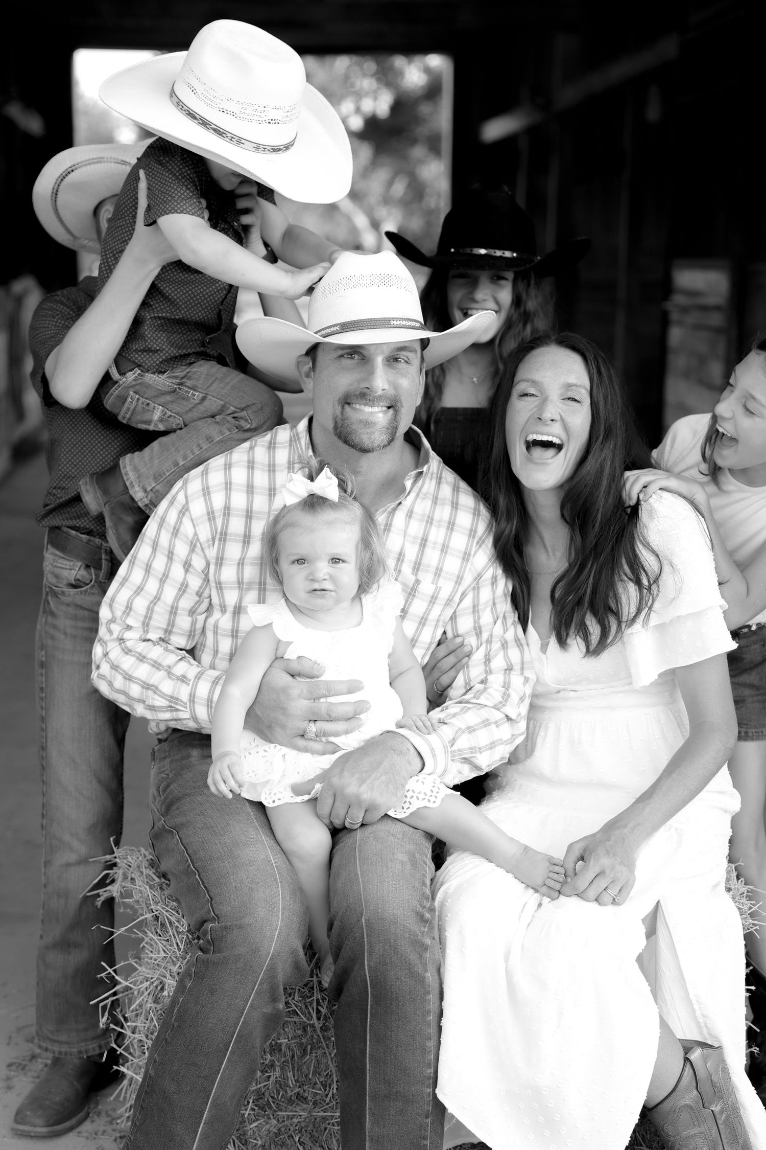 black and white family photo of family laughing wester photo