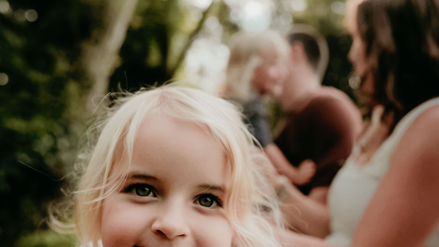 Close-up outdoor portrait with soft natural bokeh effect.