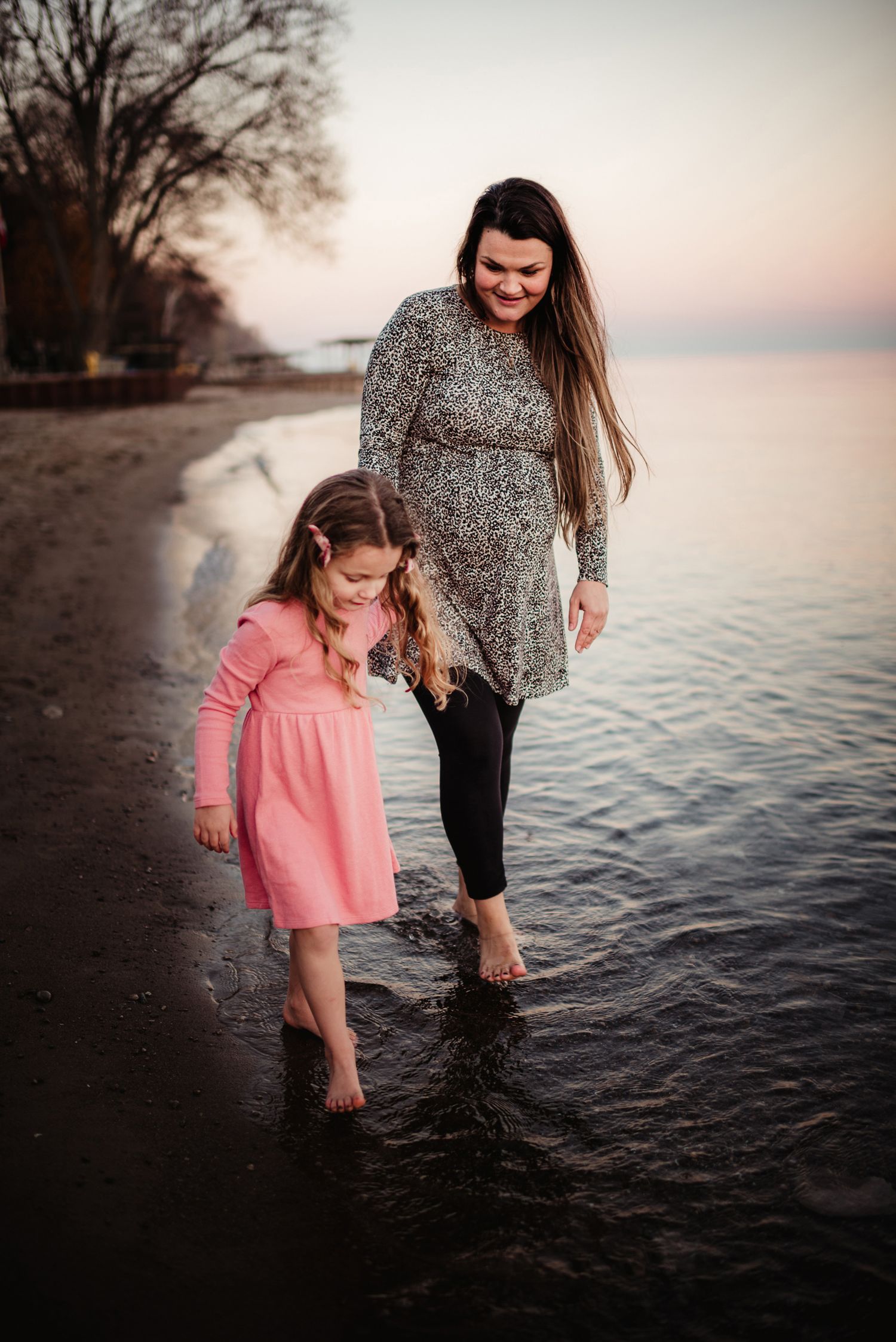 A heartwarming scene of wading in lake waters during sunset.