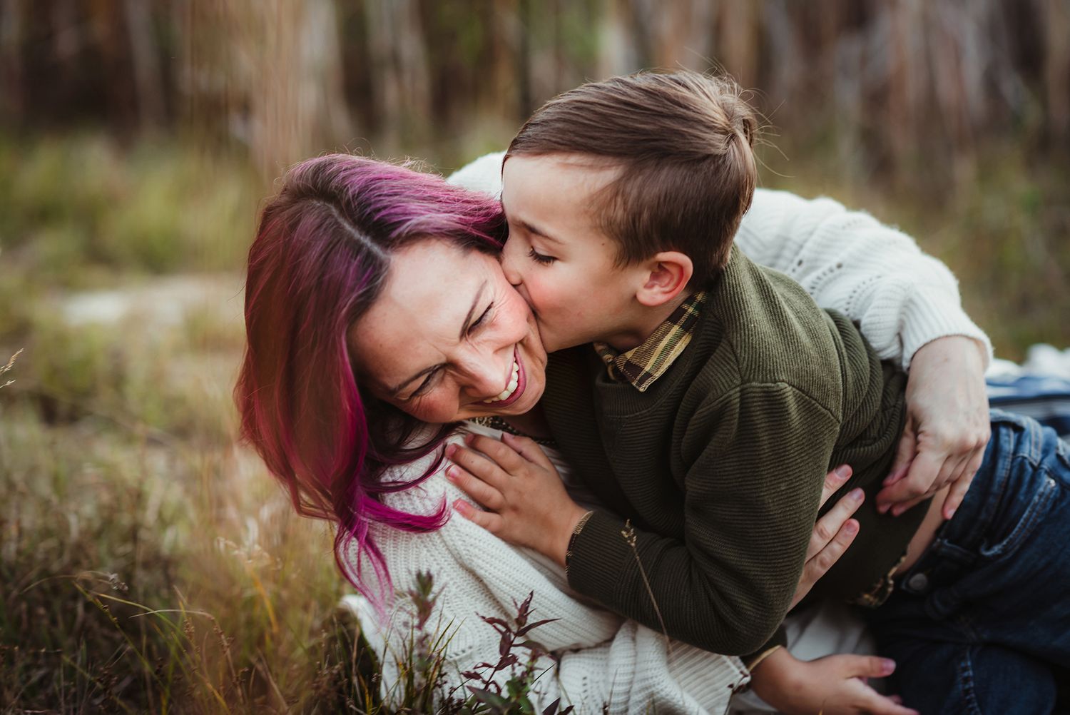 Joyful family interactions captured in a natural outdoor setting.