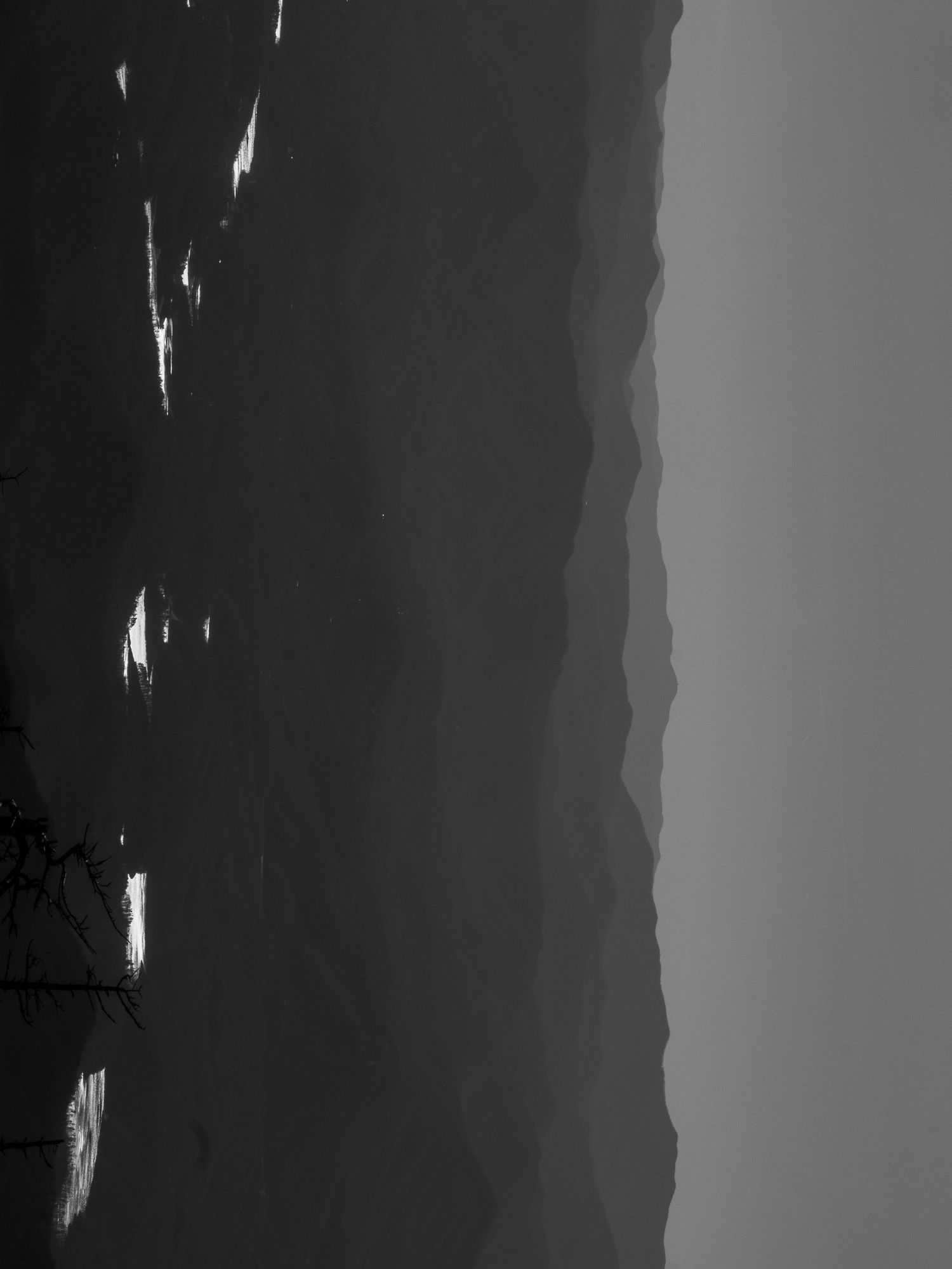 Minimalist black and white landscape silhouette with gradient sky.