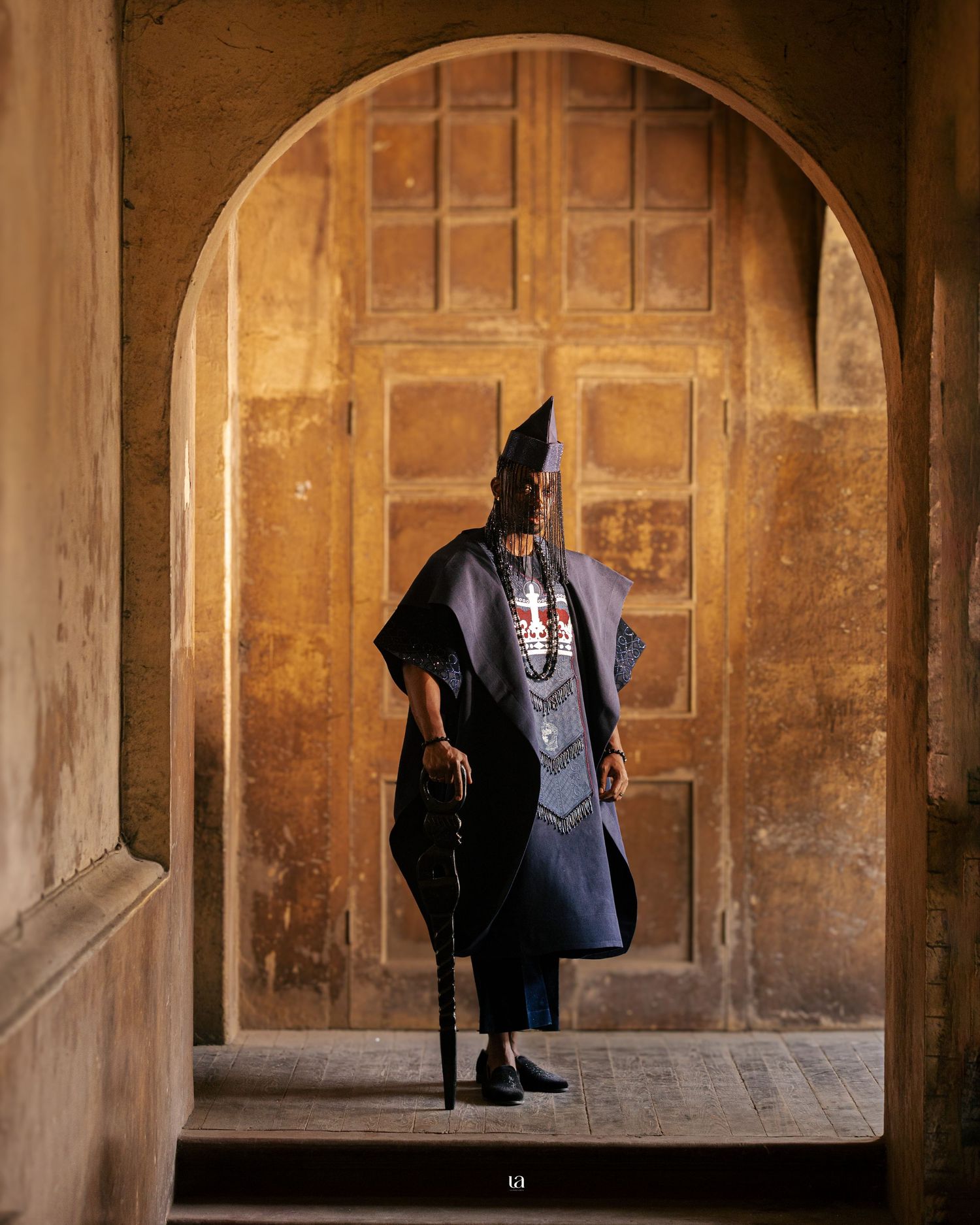 Architectural series featuring arched doorways with a figure in navy blue clothing.