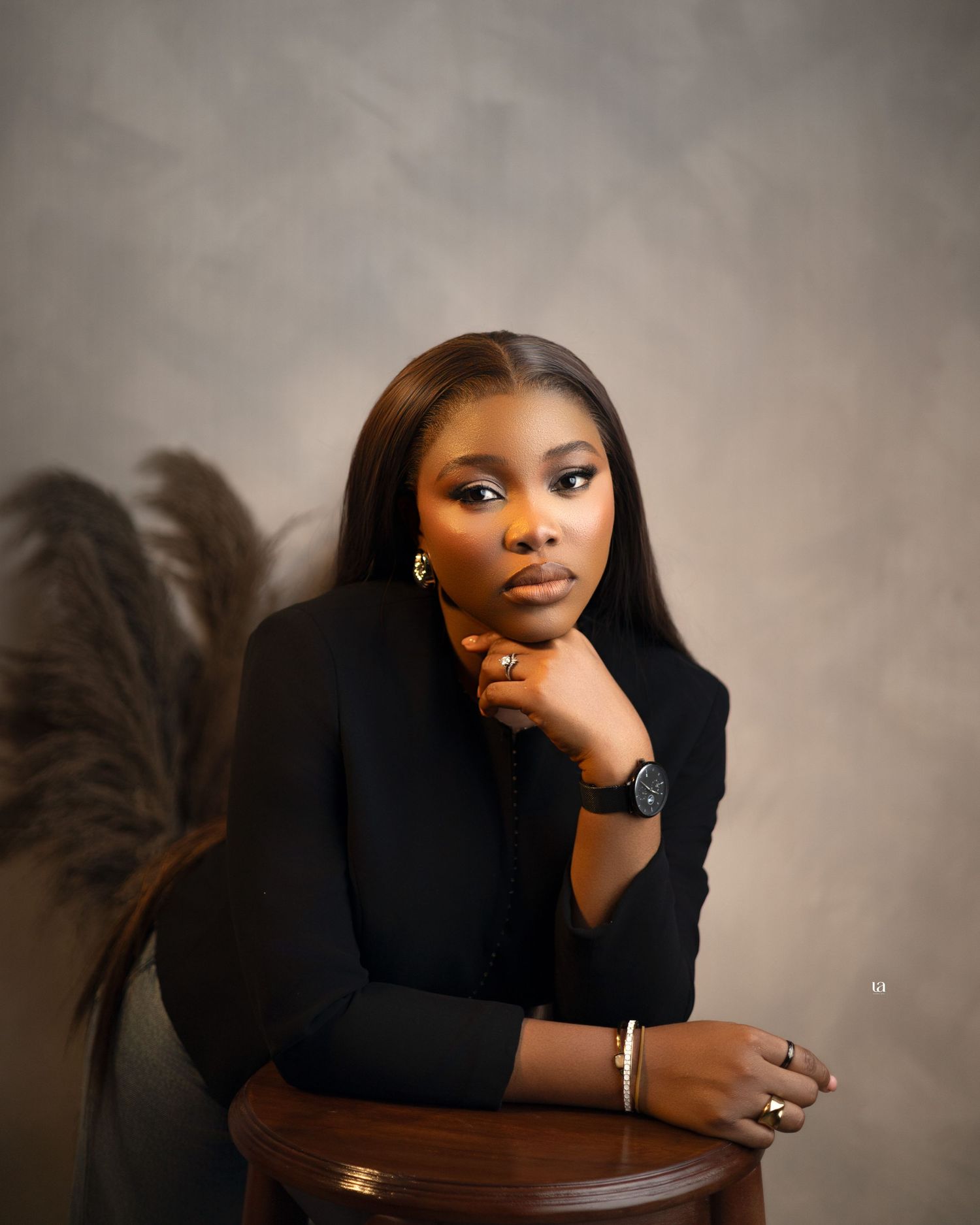 Professional studio portrait session featuring elegant poses against a neutral background.