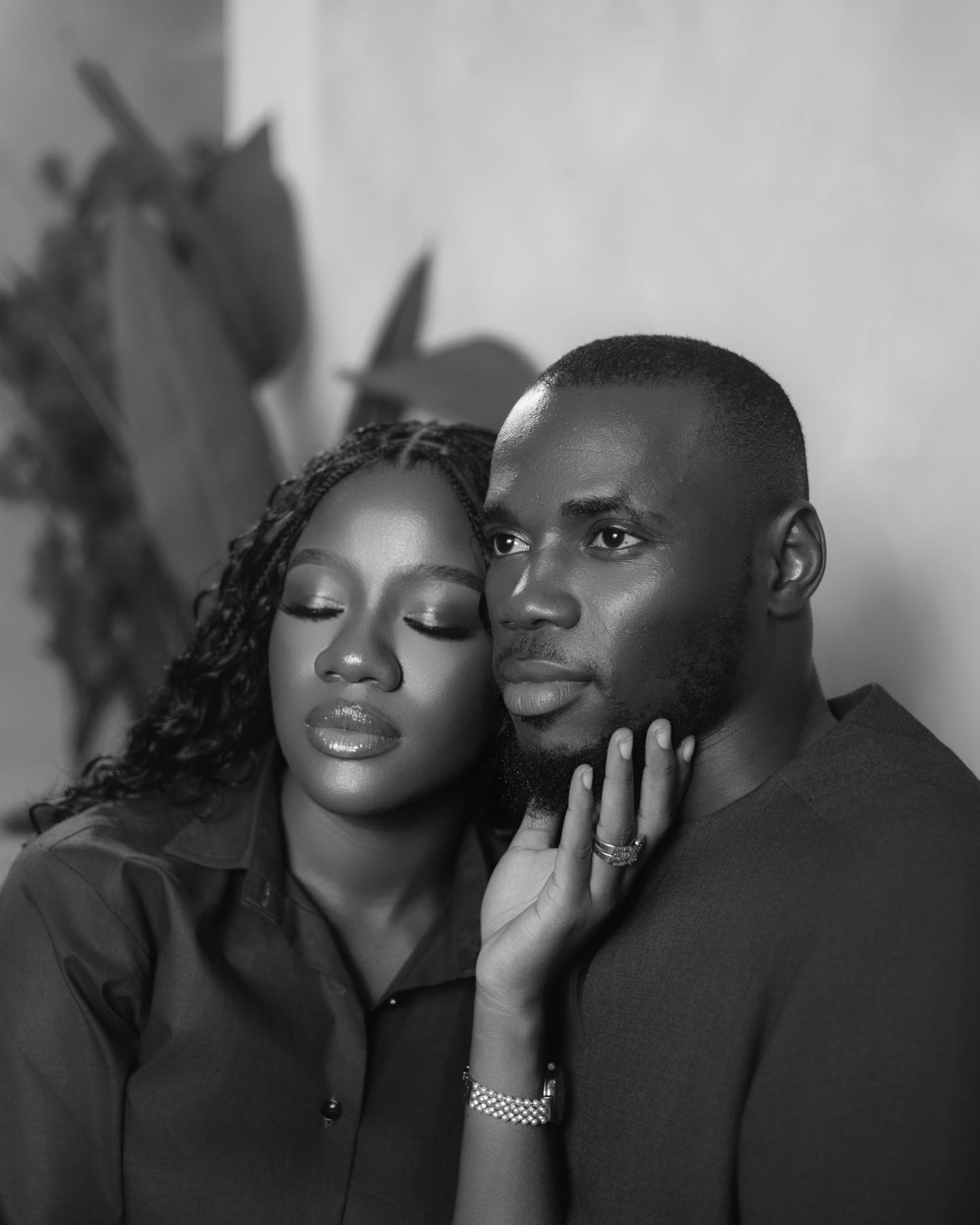 Intimate black and white portrait series capturing romantic moments between a couple.