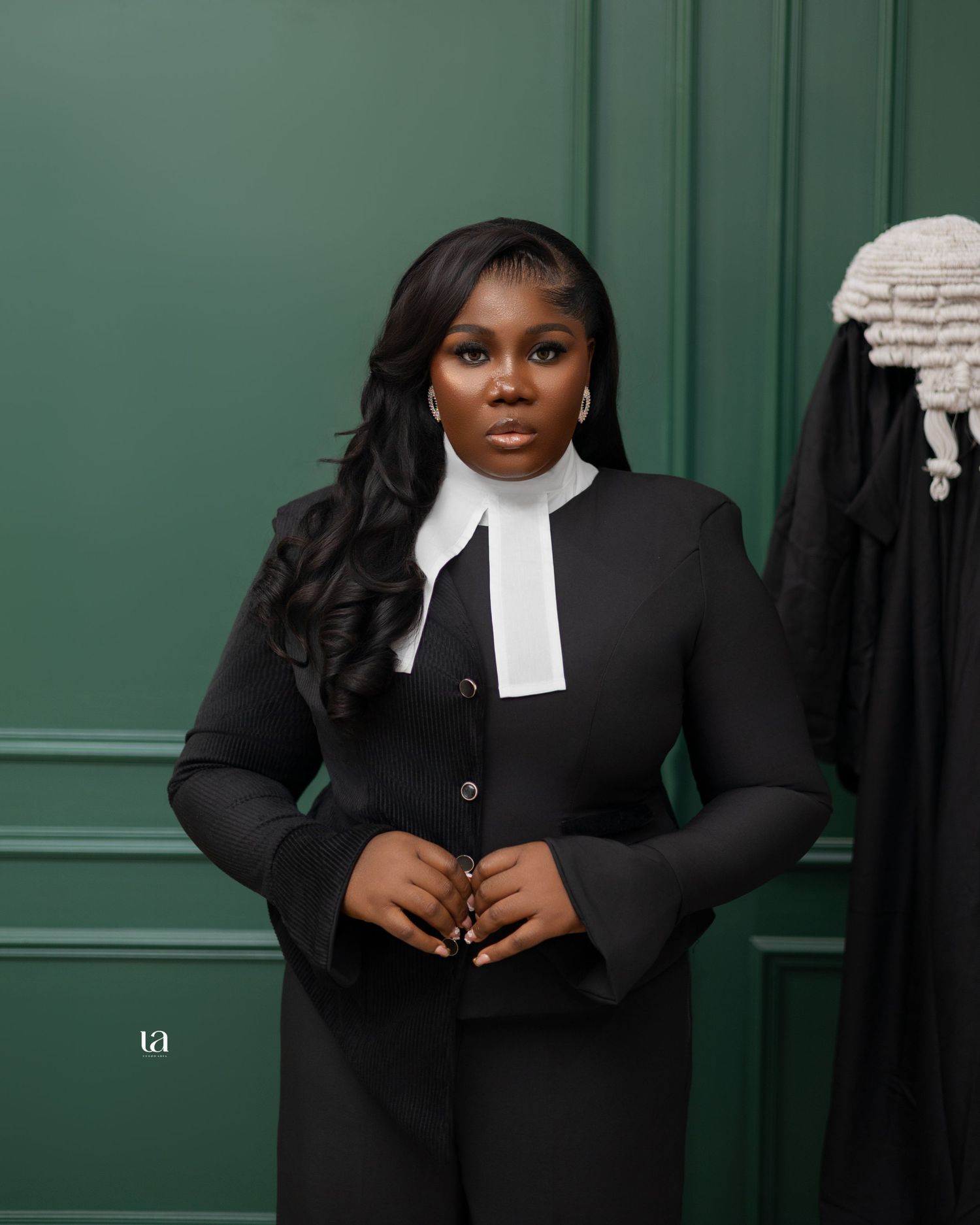 Professional legal portrait series in traditional black barrister attire against green background.