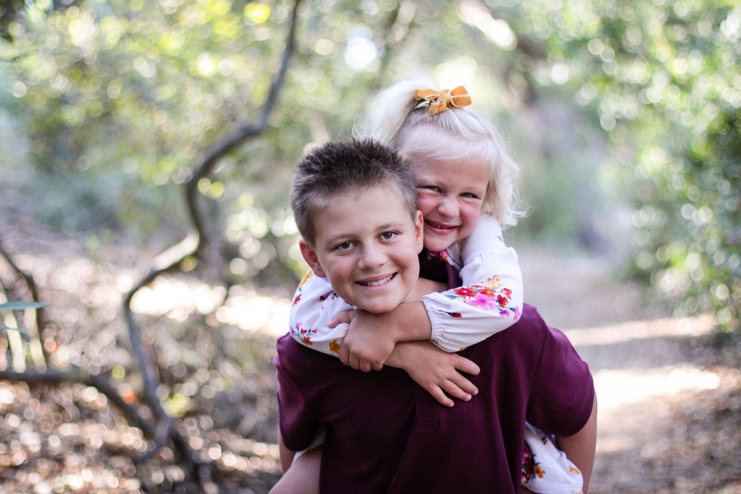 Playful family interactions captured in a sunlit outdoor setting.