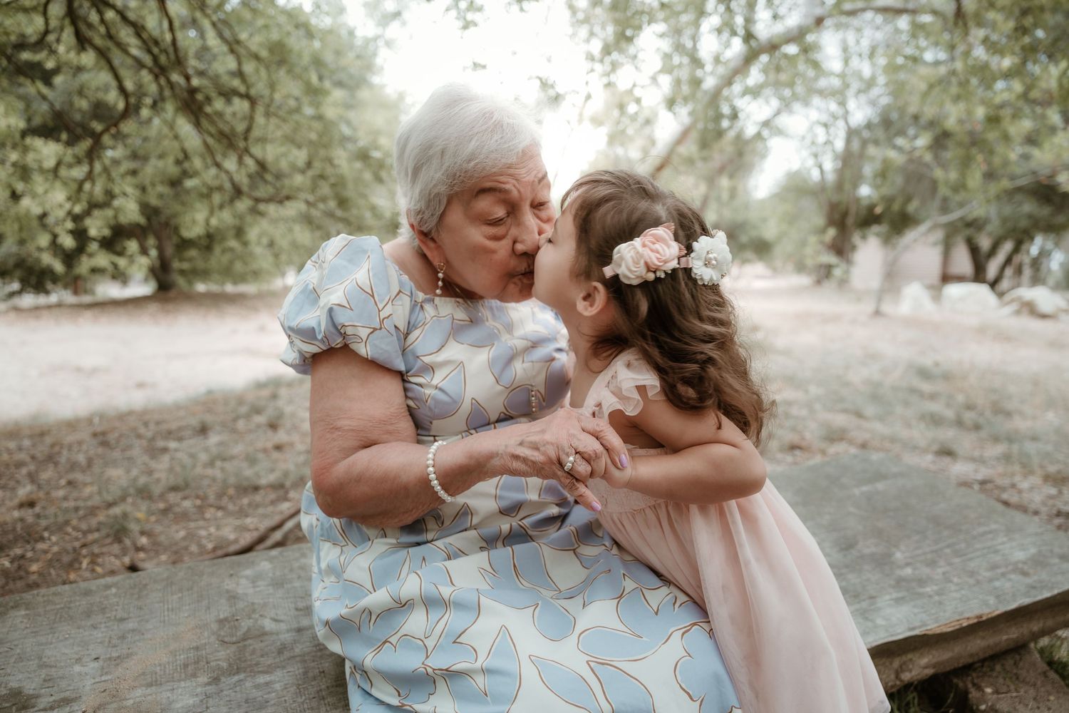 Intimate family portrait session captured in a serene outdoor setting with soft natural lighting.