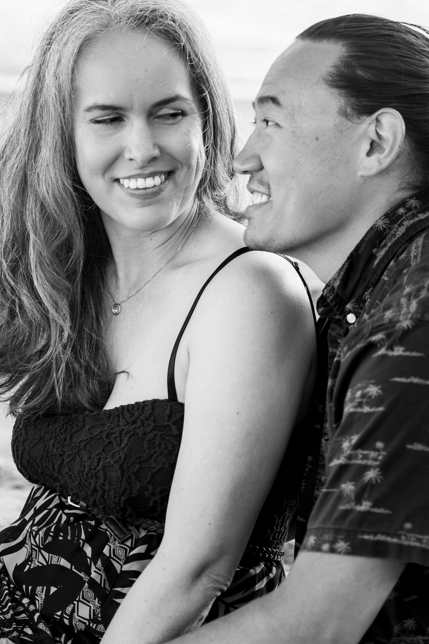 Black and white series of intimate moments between a couple showing genuine laughter and connection.