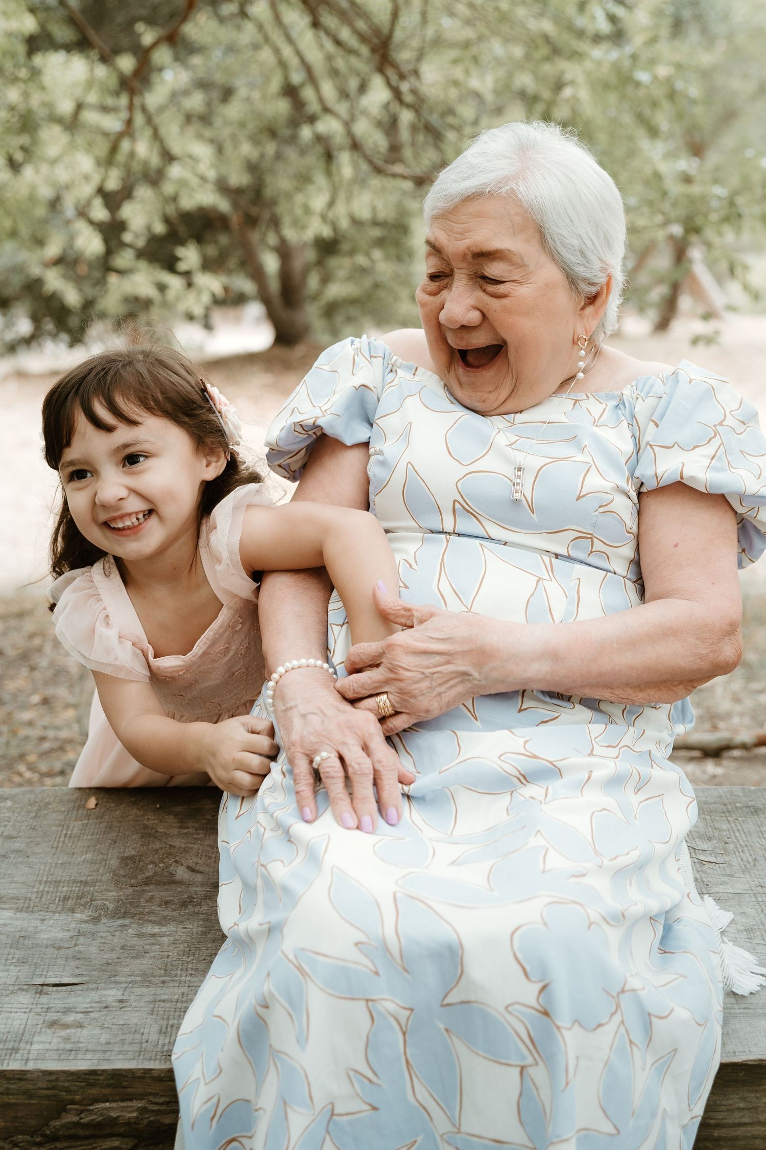 A heartwarming sequence of candid moments showing playful interaction between generations in matching floral dresses.