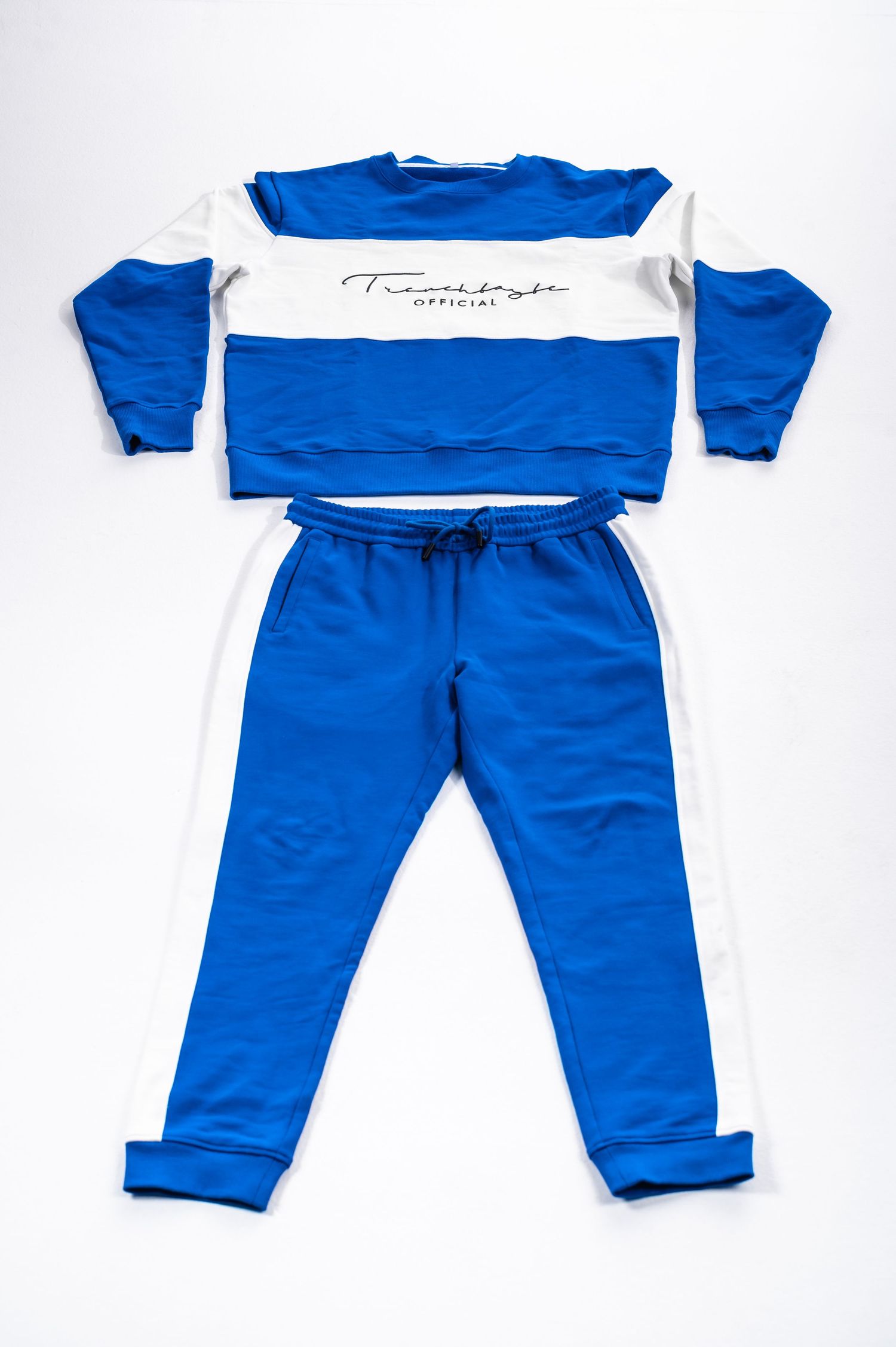 Vintage blue and white tracksuit set with long sleeves and pants shown from multiple angles.