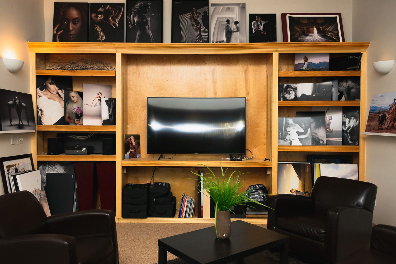 Wooden shelving unit with compartments displaying various items and decor against a wall in warm lighting.