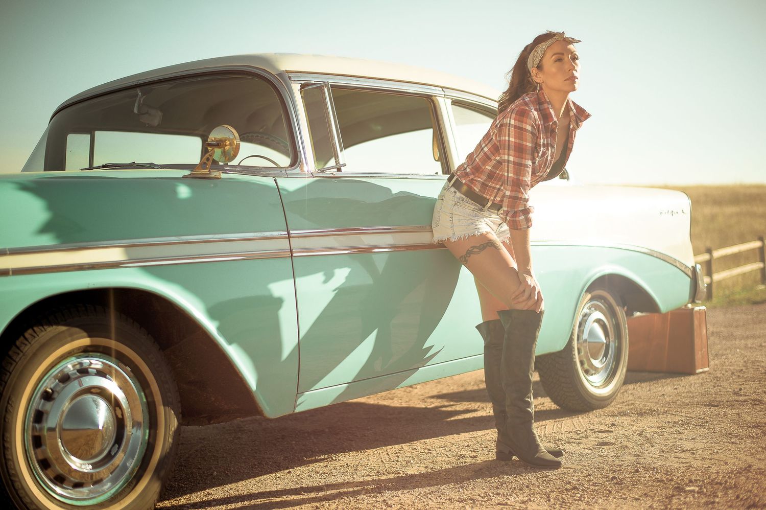 A vintage car is photographed in warm sunlight with a retro aesthetic effect.