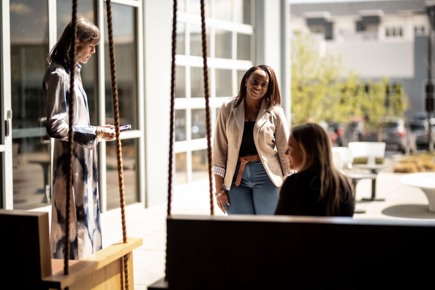 Business colleagues having a casual meeting in a bright modern office space.