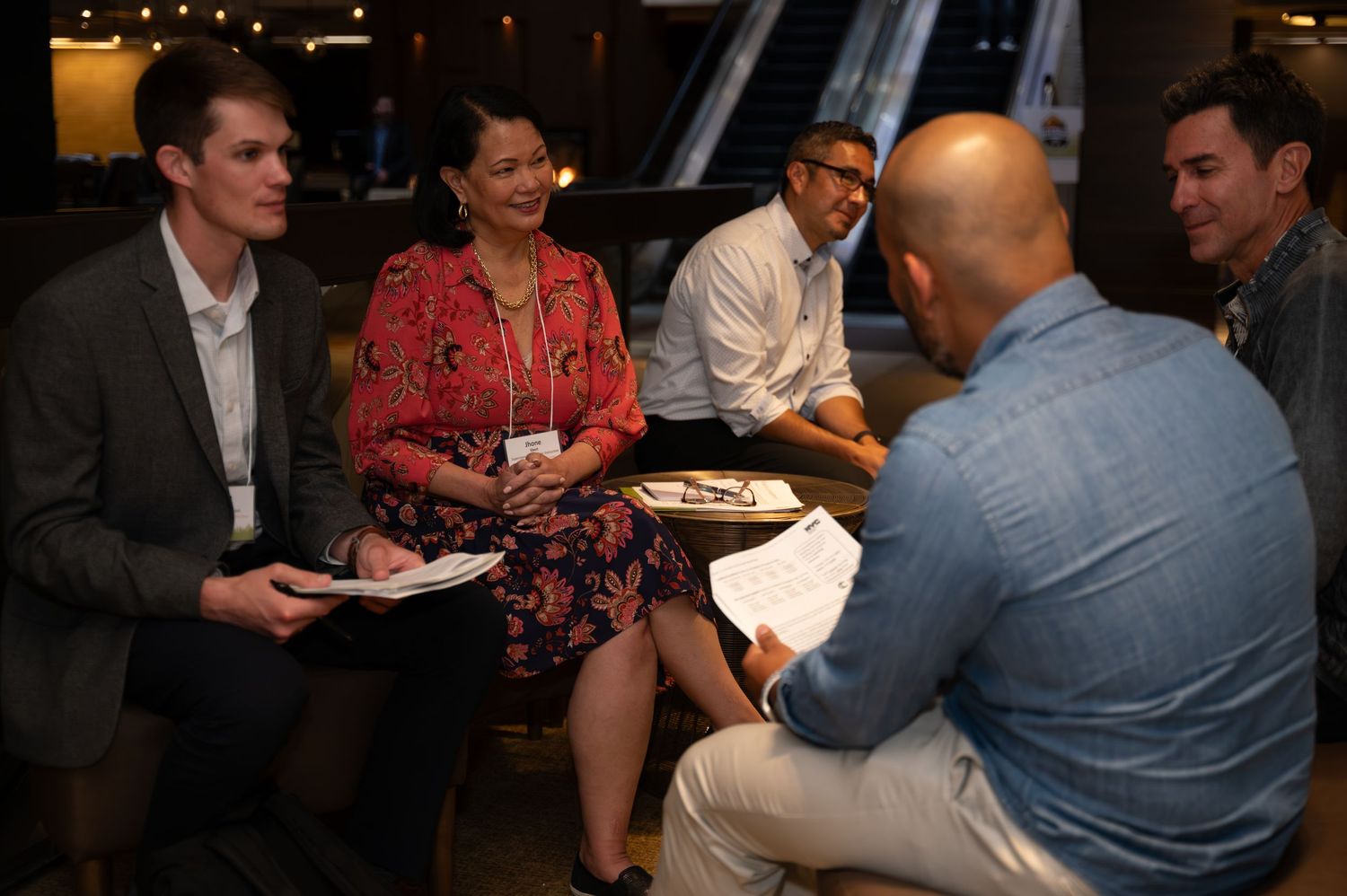 Diverse team having an informal evening business meeting.