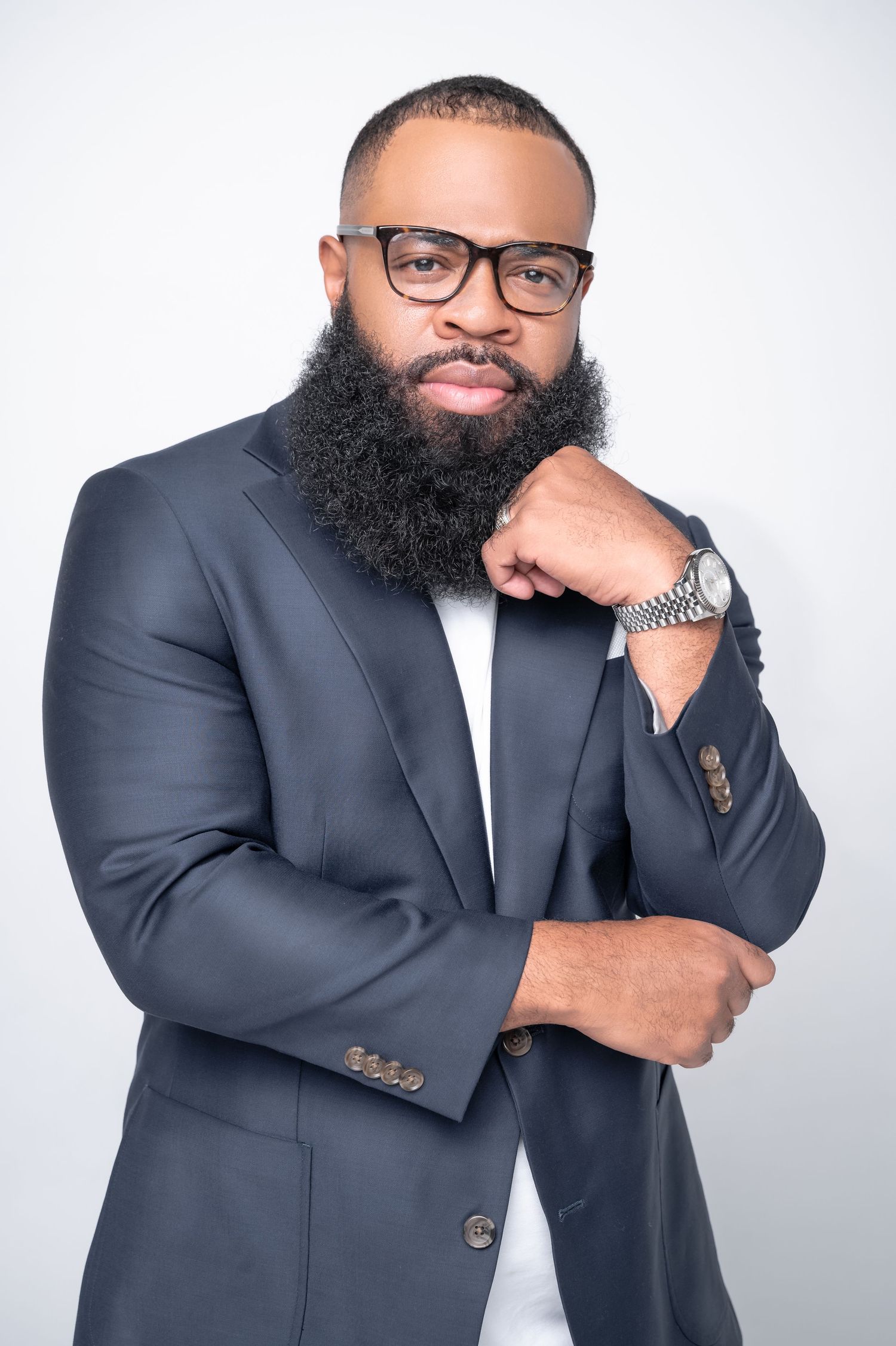 Professional headshots of a person in business attire against white background.