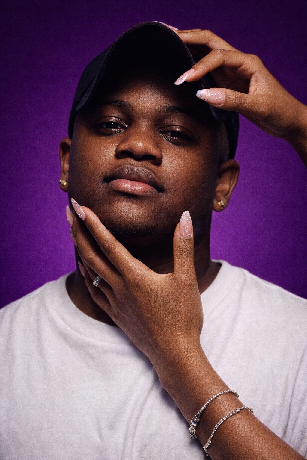 Series of artistic portrait shots against a purple background showing various poses.