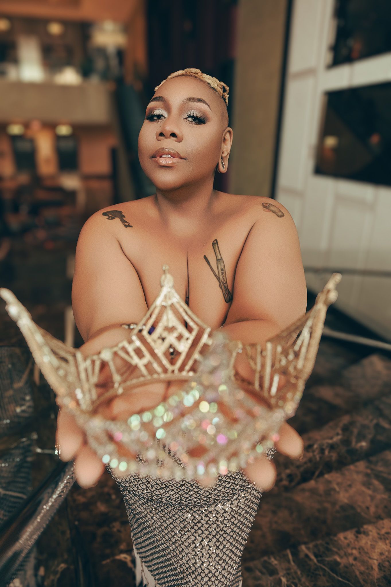 A glamorous photoshoot features crystal crowns and elegant styling.